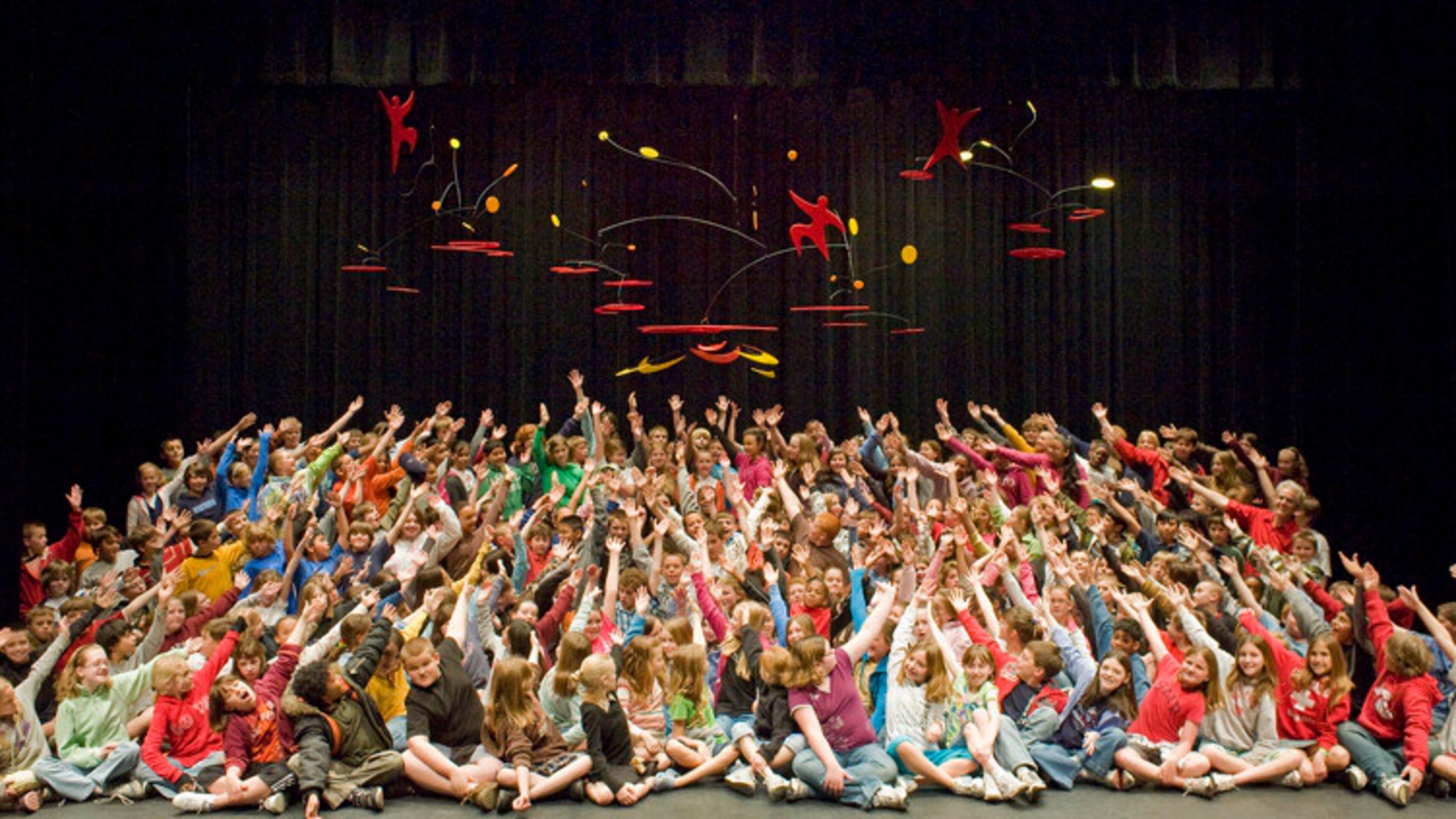 Students at a school in Gettysburg, Pa., with a mobile created with artist Kevin Reese. TEAM SCULPTURES