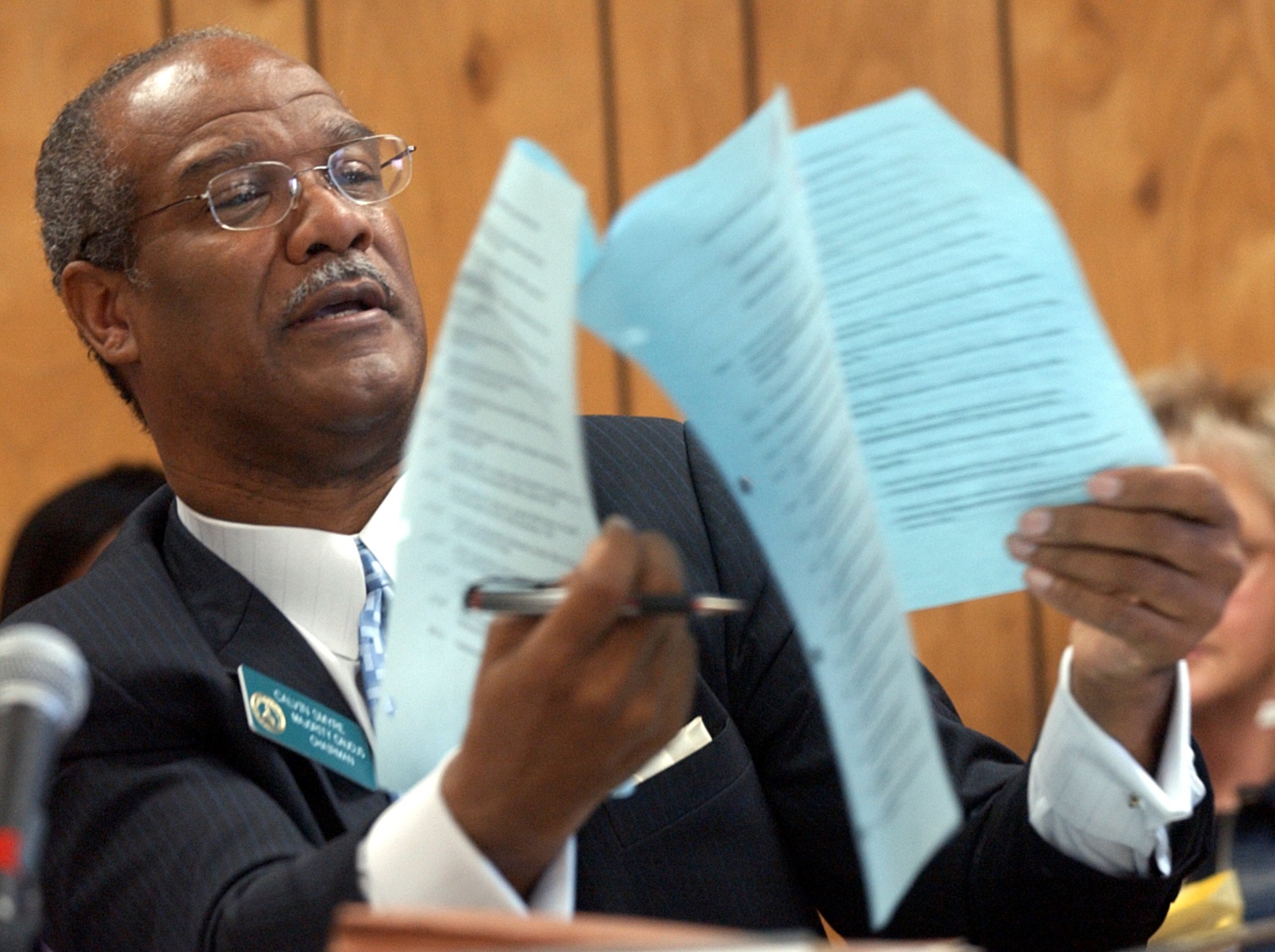 040401-ATLANTA-House Rules Committee Chairman Calvin Smyre (cq)(D-Columbus) looks over the Senate's debate calendar for Thursday, which contained more than 80 bills, and comments that the bills that were about to be taken up when the Senate adjourned Wednesday were placed well into Thursday's calendar where they are in danger of being cut off again. (BEN GRAY/STAFF) ben gray 404-964-9686
