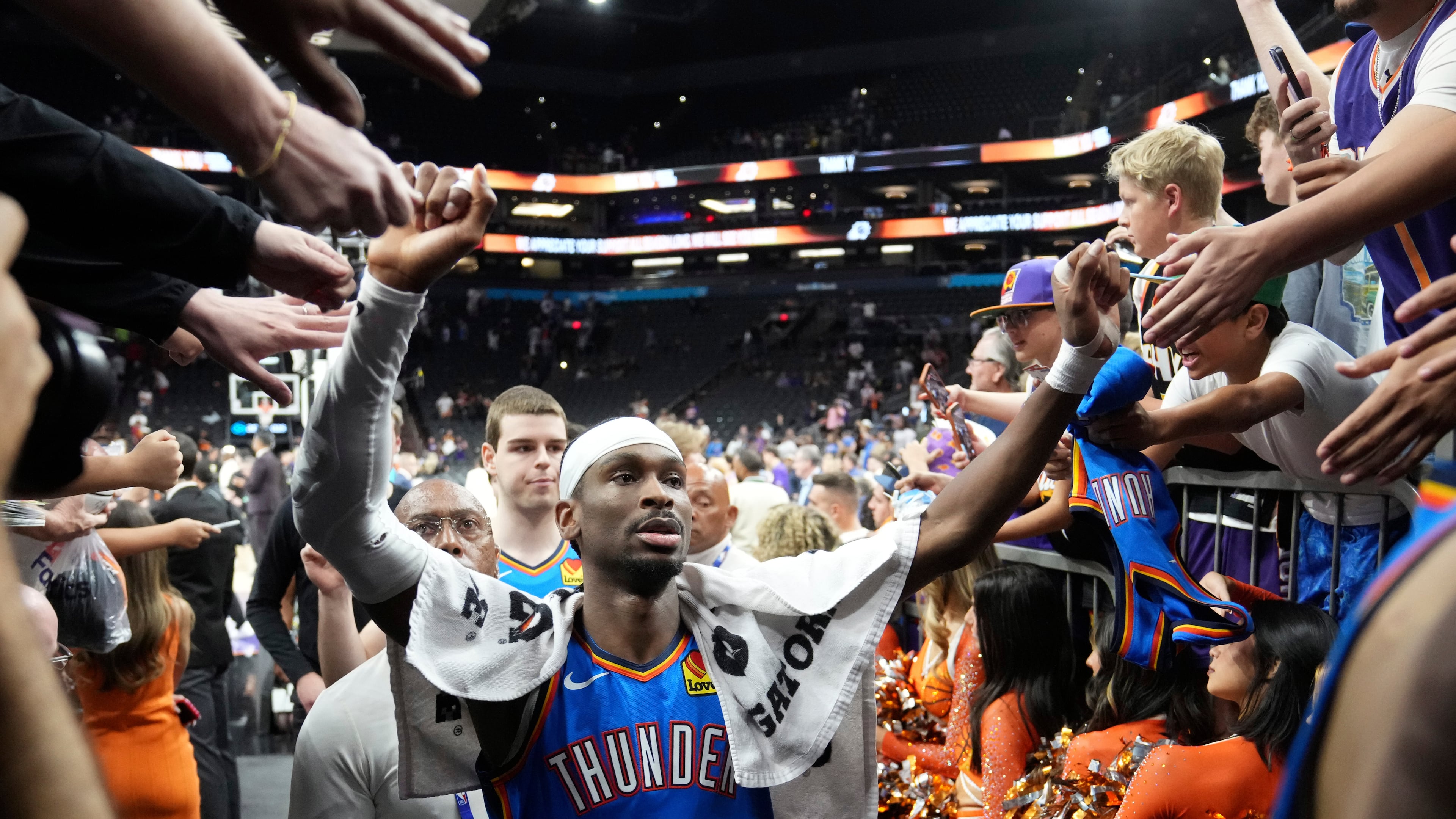 Oklahoma City Thunder guard Shai Gilgeous-Alexander celebrates with fans after Game 4 in a first-round NBA playoffs basketball series against the Phoenix Suns, Monday, April 27, 2026, in Phoenix. (AP Photo/Ross D. Franklin)