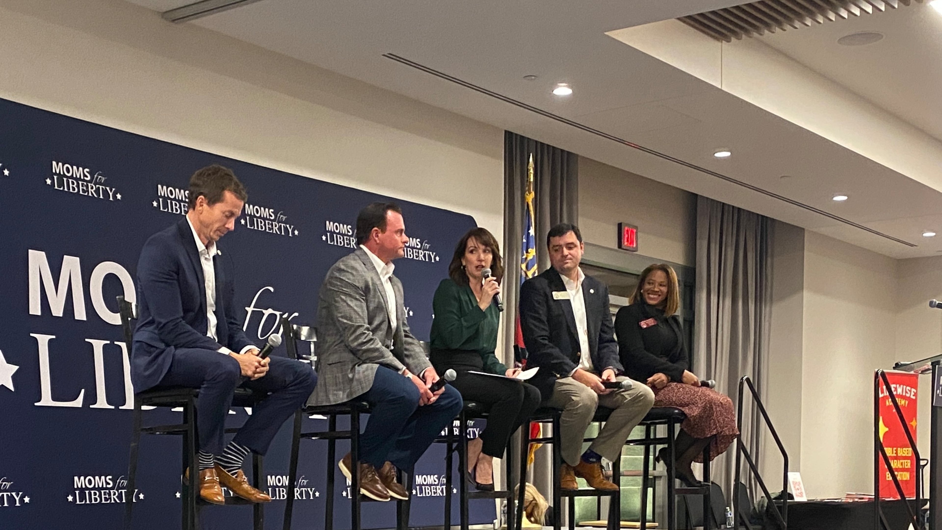 Moms for Liberty co-founder Tina Descovich (center) leads a panel discussion with Georgia Republican lawmakers Sen. Greg Dolezal (from left), Sen. Clint Dixon, Rep. Scott Hilton and Rep. Mesha Mainor on Nov. 13, 2023, at the Gas South Convention Center in Duluth. (Josh Reyes / Josh.Reyes@ajc.com)