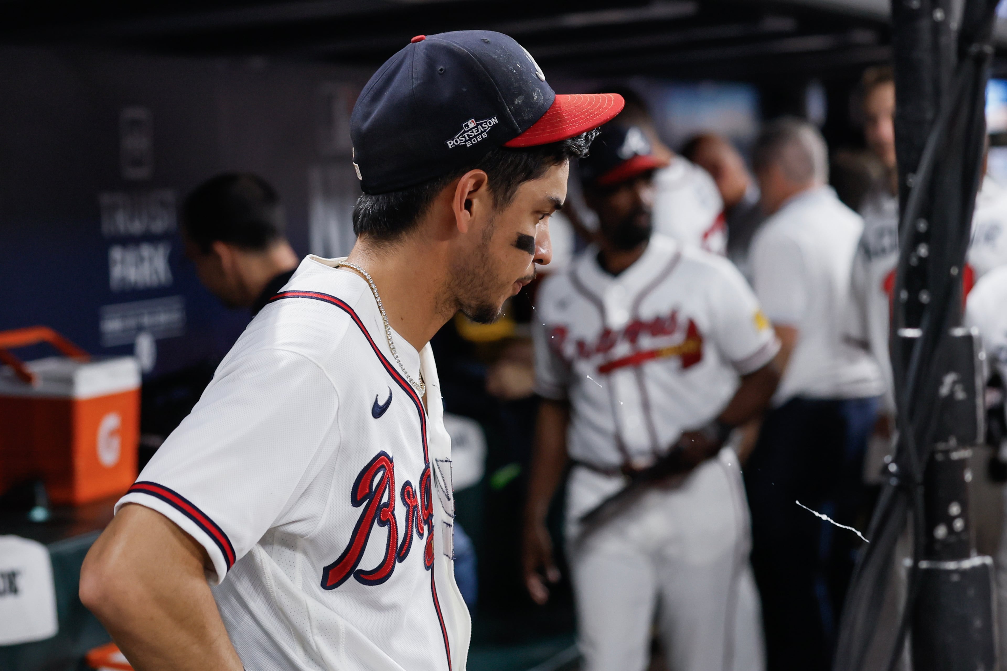 Atlanta Braves shortstop Mauricio Dubon (14) reacts in the dugout after losing to the Los Angeles Dodgers in Game 4 of the MLB National League Division Series between the Atlanta Braves and the Los Angeles Dodgers, Wednesday, Oct. 7, 2026, in Atlanta. The Dodgers defeated the Braves 3 games to 1. (Miguel Martinez/AJC)