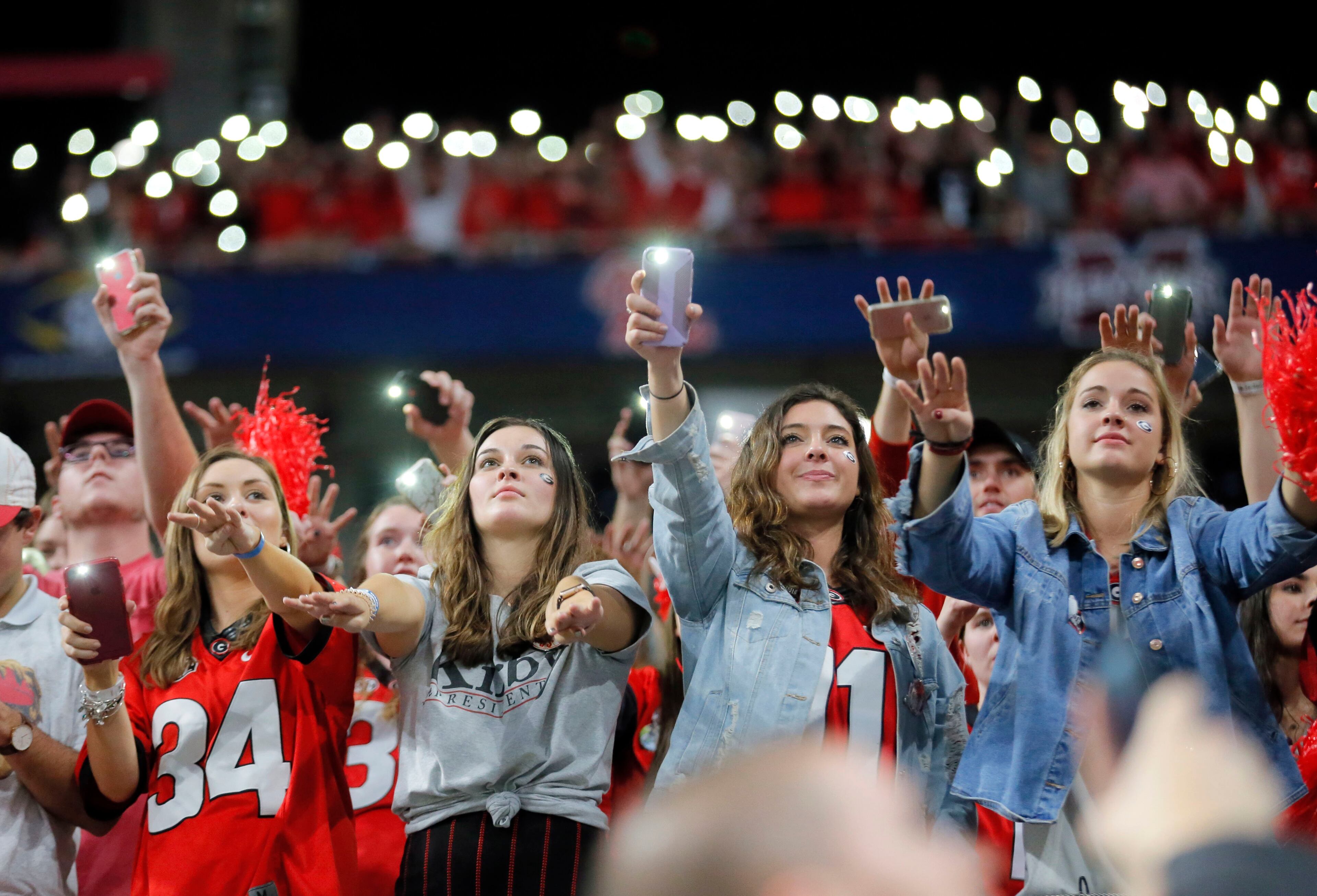 12/1/18 - Atlanta - Fans light their phones at the start of the fourth quarter. The University of Georgia Bulldogs lost to the Alabama Crimson Tide 35 - 28 in a NCAA college football game for the Southeastern Conference Championship Saturday, Dec. 1, 2018, at Mercedes-Benz Stadium in Atlanta, GA. BOB ANDRES / BANDRES@AJC.COM