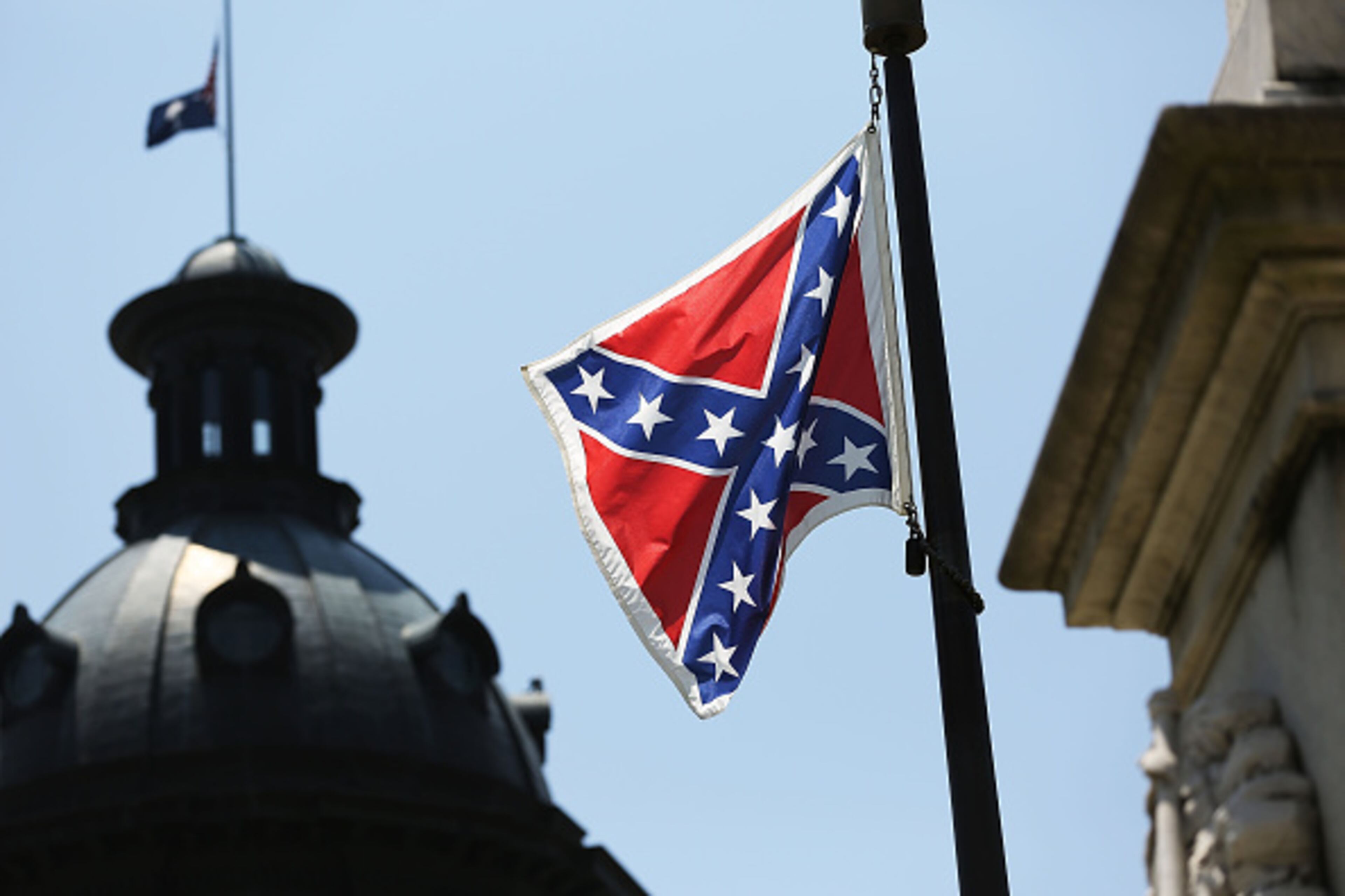 COLUMBIA, SC - JUNE 23: The Confederate flag is seen flying on the Capitol grounds a day after South Carolina Gov. Nikki Haley announced that she will call for the Confederate flag to be removed on June 23, 2015 in Columbia, South Carolina. Debate over the flag flying on the capitol grounds was kicked off after nine people were shot and killed during a prayer meeting at the Emanuel African Methodist Episcopal Church in Charleston, South Carolina. (Photo by Joe Raedle/Getty Images)