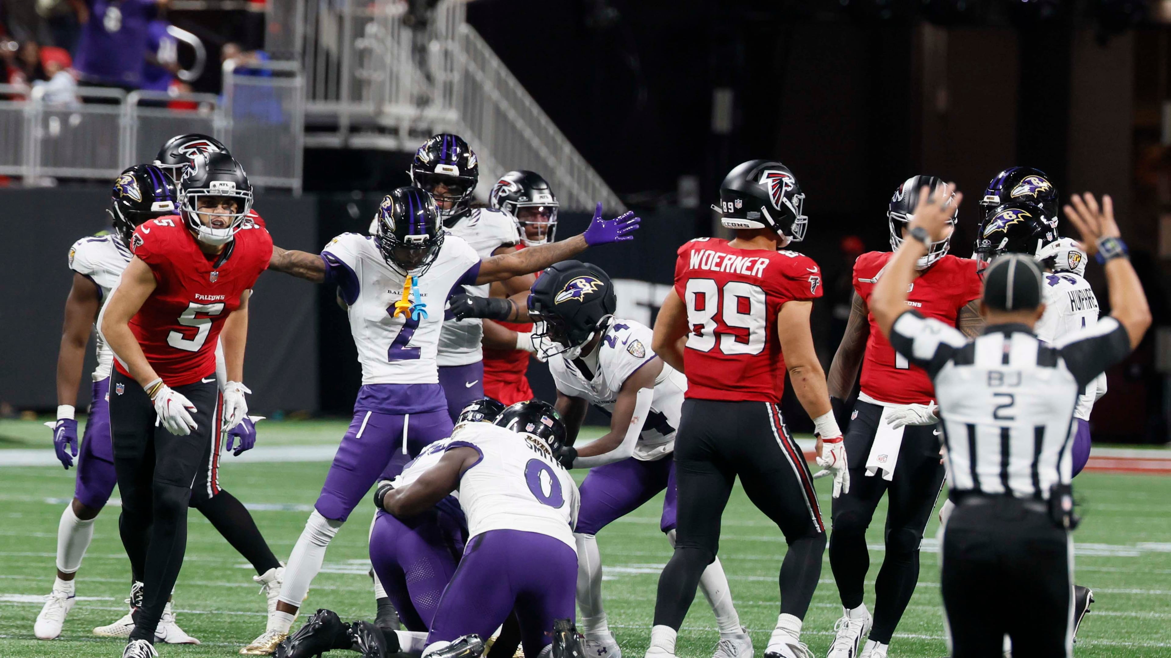 Baltimore Ravens players react after intercepting a pass from Atlanta Falcons quarterback Tua Tagovailoa (1) intended for wide receiver Drake London (5). As a result, the Falcons lose to the Baltimore Ravens 30-23 in overtime at Mercedes-Benz Stadium in Atlanta, GA, on Sunday, Oct. 11, 2026. (Miguel Martinez/AJC)