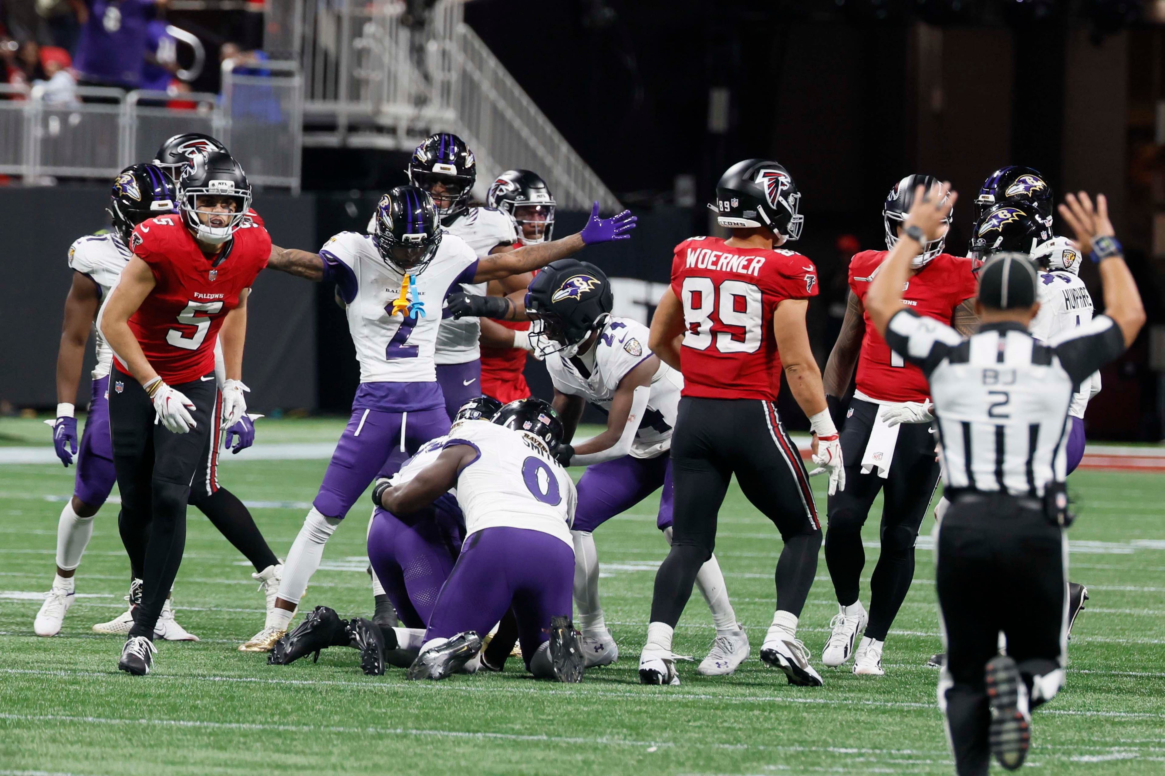 Baltimore Ravens players react after intercepting a pass from Atlanta Falcons quarterback Tua Tagovailoa (1) intended for wide receiver Drake London (5). The Falcons lost to the Baltimore Ravens 30-23 in overtime at Mercedes-Benz Stadium in Atlanta, GA, on Sunday, Oct. 11, 2026. (Miguel Martinez/AJC)