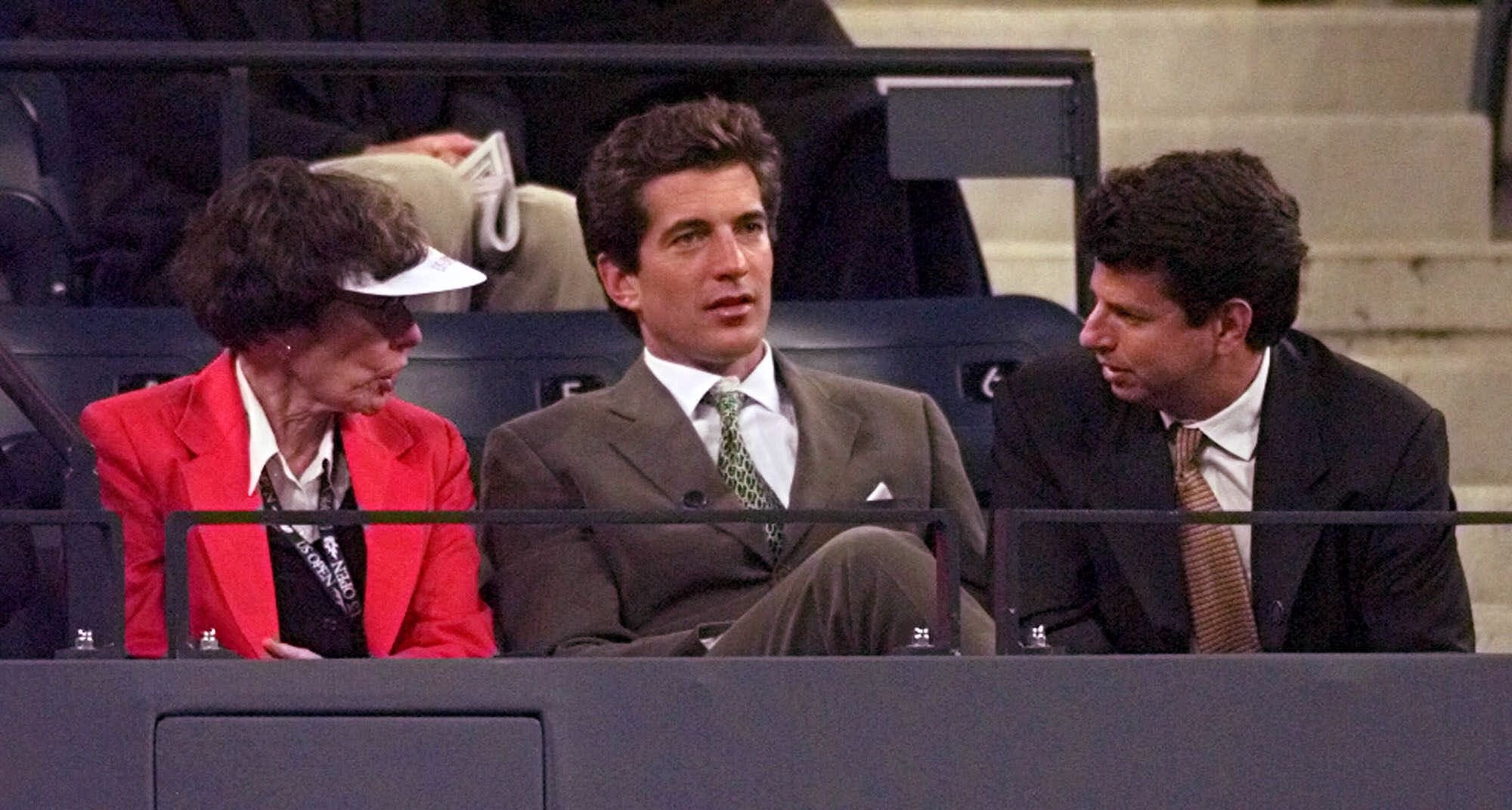 John F. Kennedy Jr., center, watches the men's quaterfinal match between Mark Philippoussis, of Australia, and Thomas Johansson, of Sweden, with unidentified friends Thursday, Sept. 10, 1998, at the U.S. Open tennis tournament in New York. (AP Photo/Ron Frehm)
