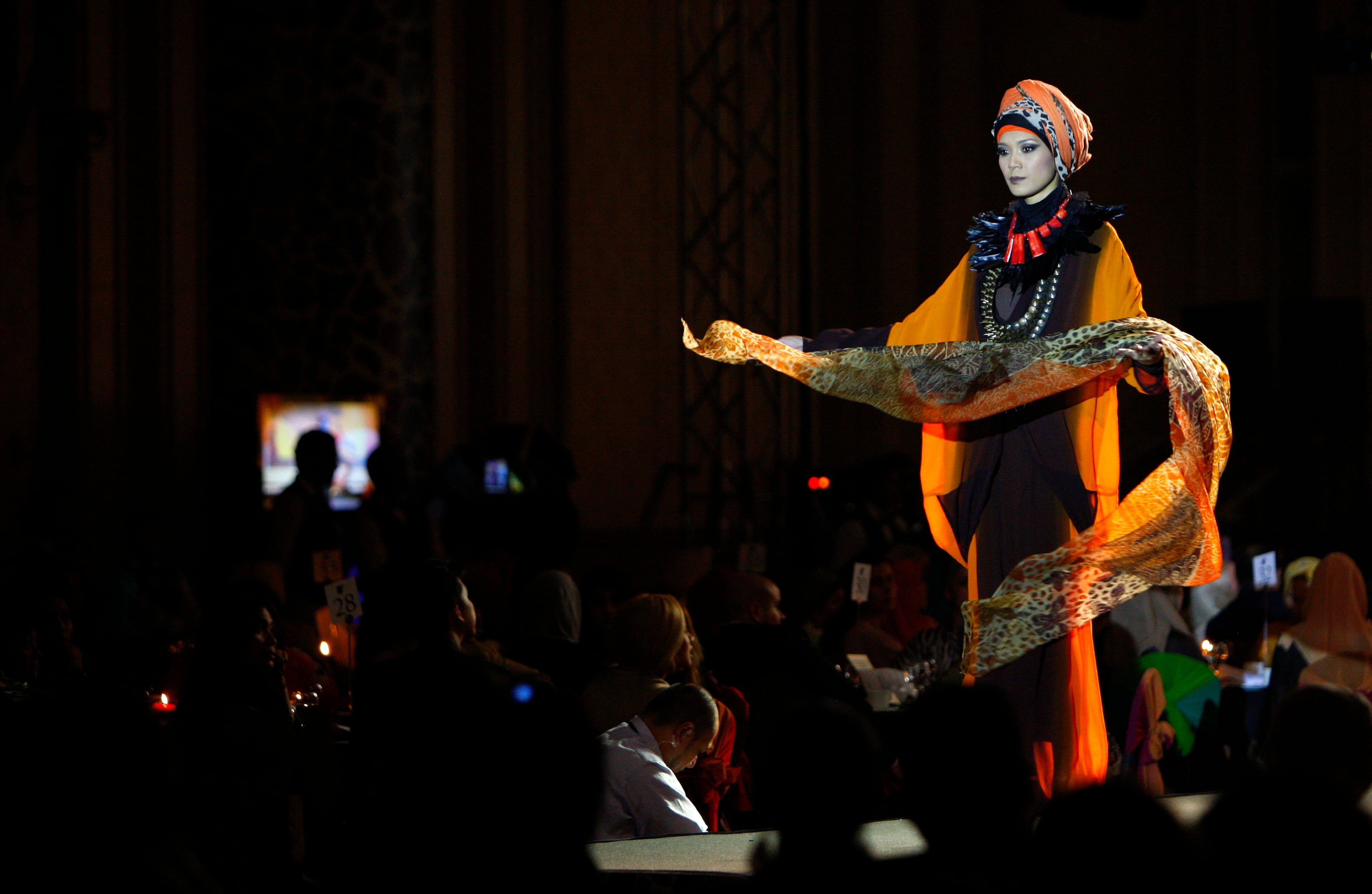 A model presents a creation by designer Tom Abang Saufi from Malaysia during the Islamic Fashion Festival in Kuala Lumpur, Malaysia, Monday, Nov. 5, 2012.
