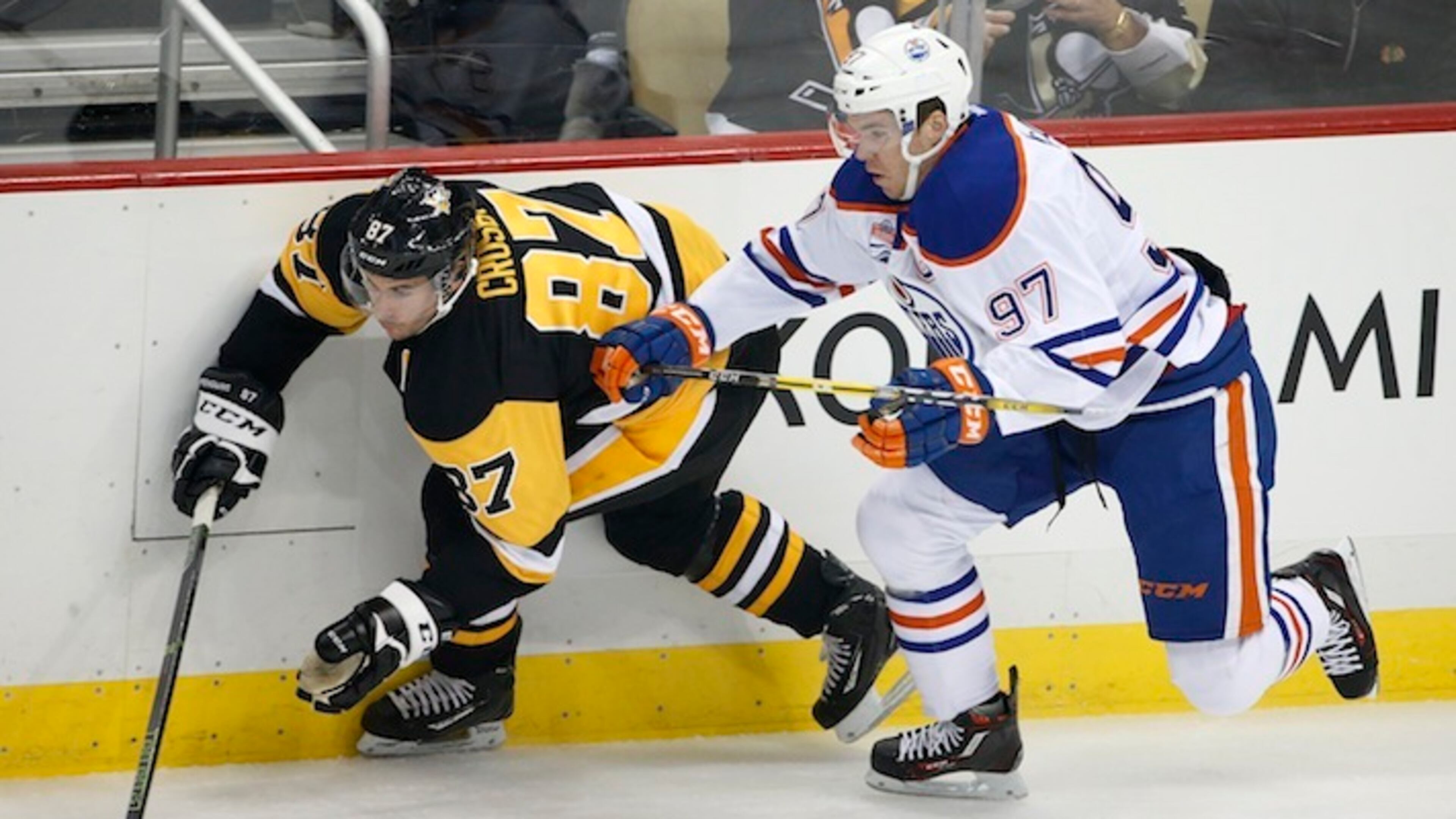 In this Nov. 8, 2016, file photo, Edmonton Oilers' Connor McDavid (97) and Pittsburgh Penguins' Sidney Crosby (87) battle for the puck during the first period of an NHL hockey game in Pittsburgh. Coming off back-to-back Conn Smythe Trophies as playoff MVP with the Stanley Cup champion Penguins, Crosby is widely considered by his peers as the best player in hockey. Crosby has just one true rival in that department: 20-year-old reigning MVP Connor McDavid, whose speed makes him a threat to be the NHL's best for the next decade or more. (AP Photo/Gene J. Puskar, File)