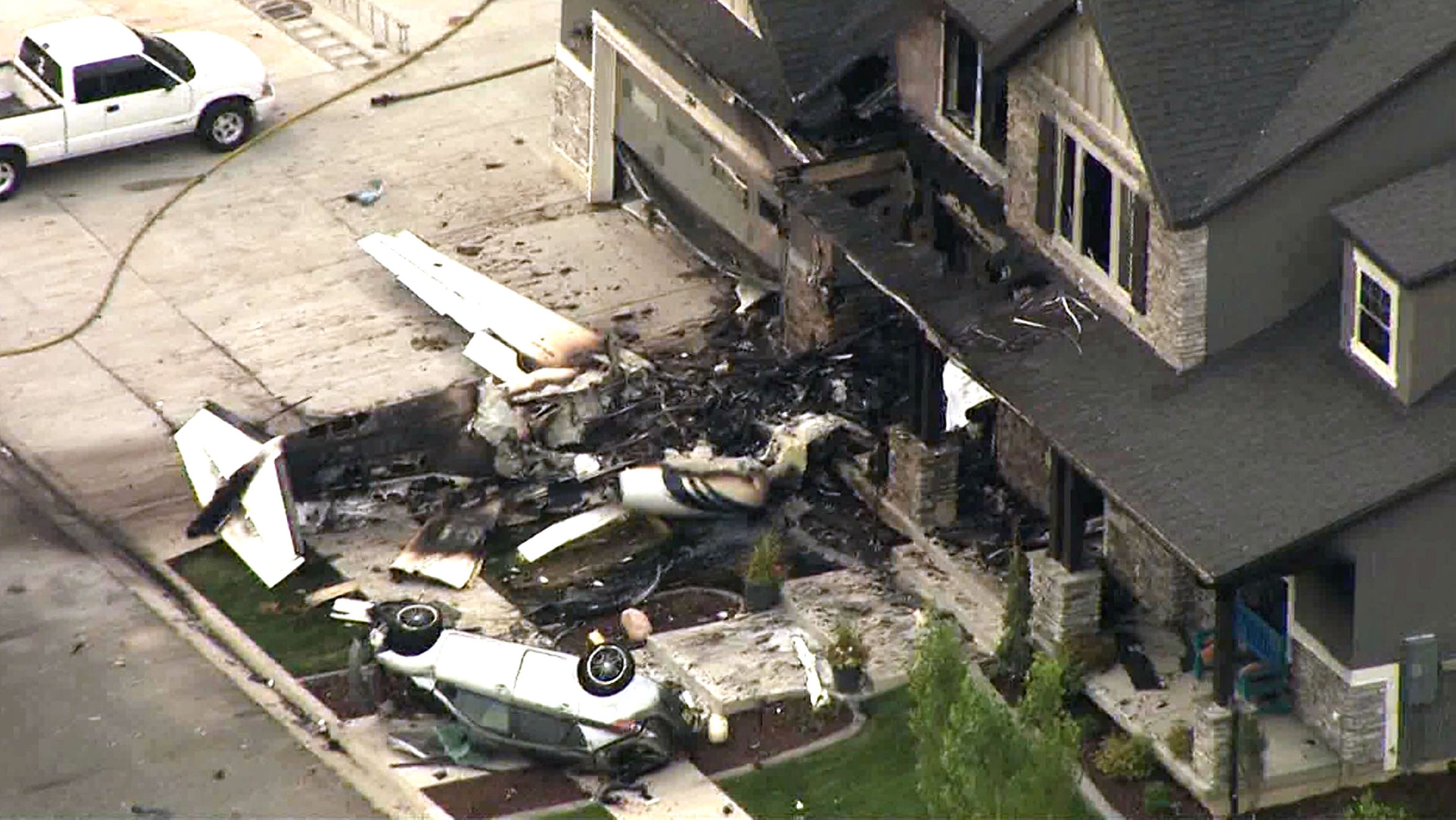A frame from video shows the scene where Duane Youd flew a Cessna 525 CitationJet into his own home early Monday, Aug. 13, 2018, in Payson, Utah. Youd, 47, was killed in the crash, which took place after he was charged with assaulting his wife the night before. The wife and her son, who were inside the house when the plane struck it, were unharmed.