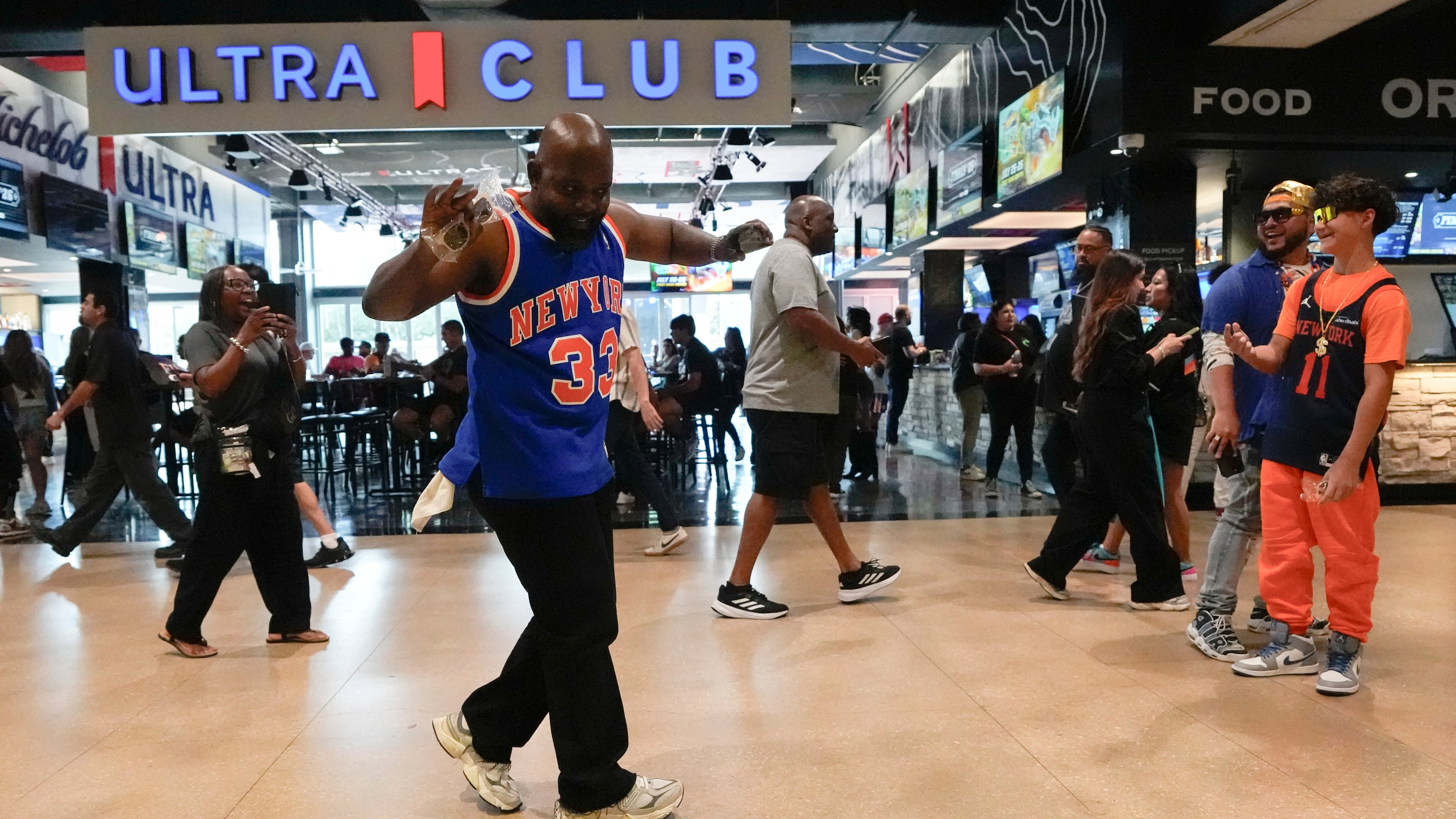 A New York Knicks fan arrives prior to Game 1 of the NBA Finals basketball series against the San Antonio Spurs, Wednesday, June 3, 2026, in San Antonio. (AP Photo/David J. Phillip)