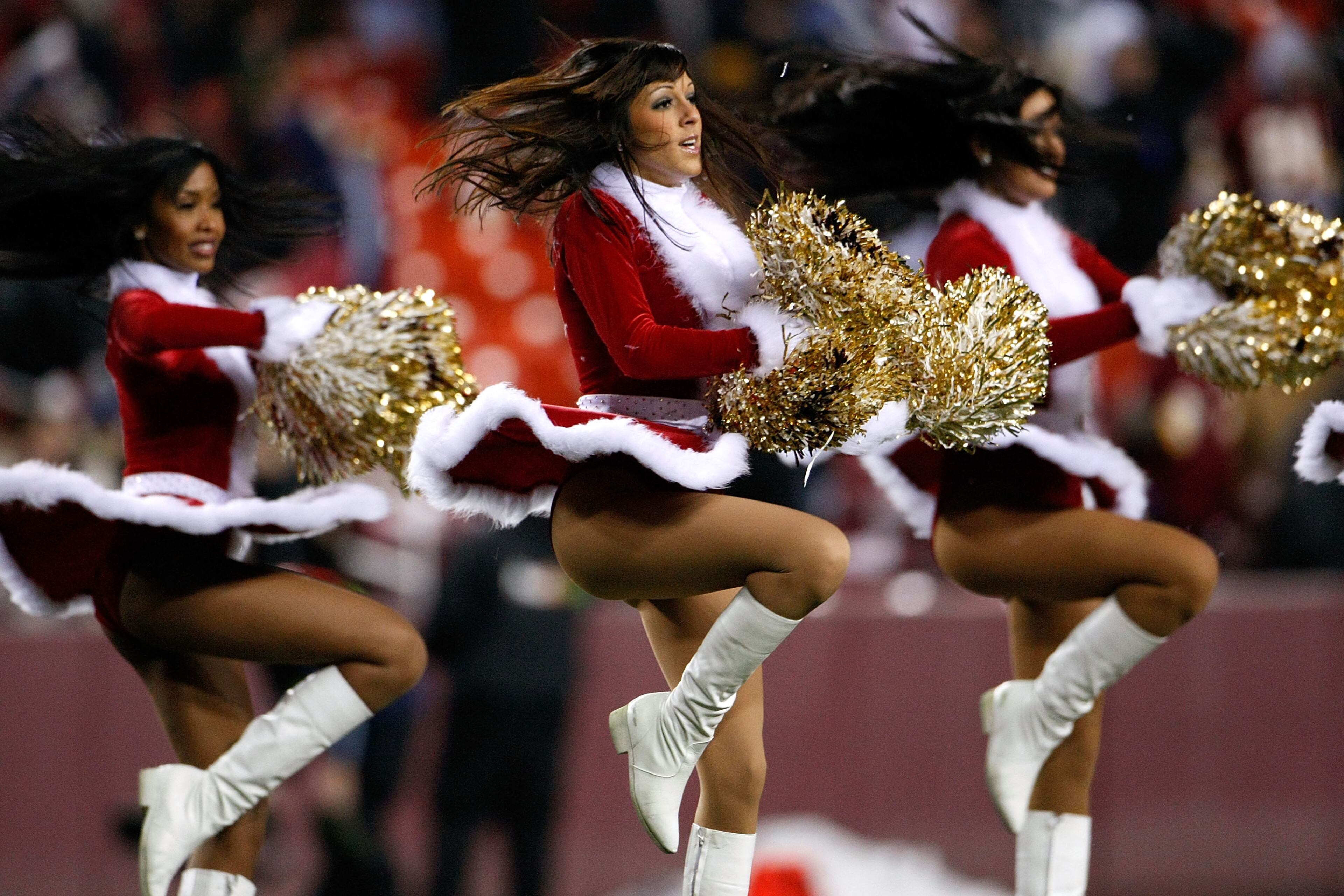 Washington Redskins cheerleaders perform in Christmas costumes during halftime in a game against the Chicago Bears at FedEx Field Dec. 6, 2007 in Landover, Md.