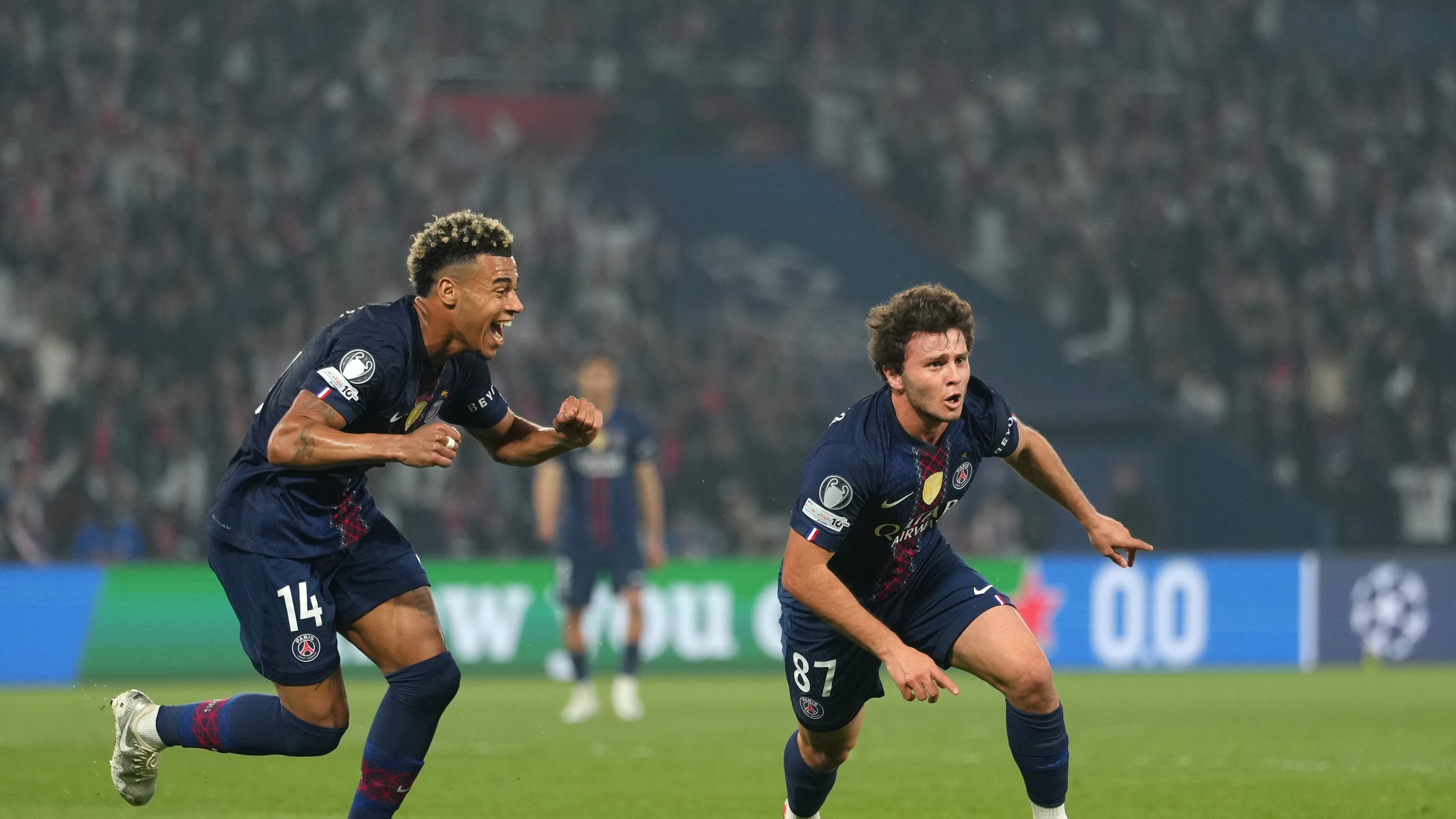 PSG's Joao Neves, right, celebrates after scoring his side's second goal during a Champions League semifinal, first leg, soccer match between Paris Saint-Germain and Bayern Munich in Paris, Tuesday, April 28, 2026. (AP Photo/Aurelien Morissard)