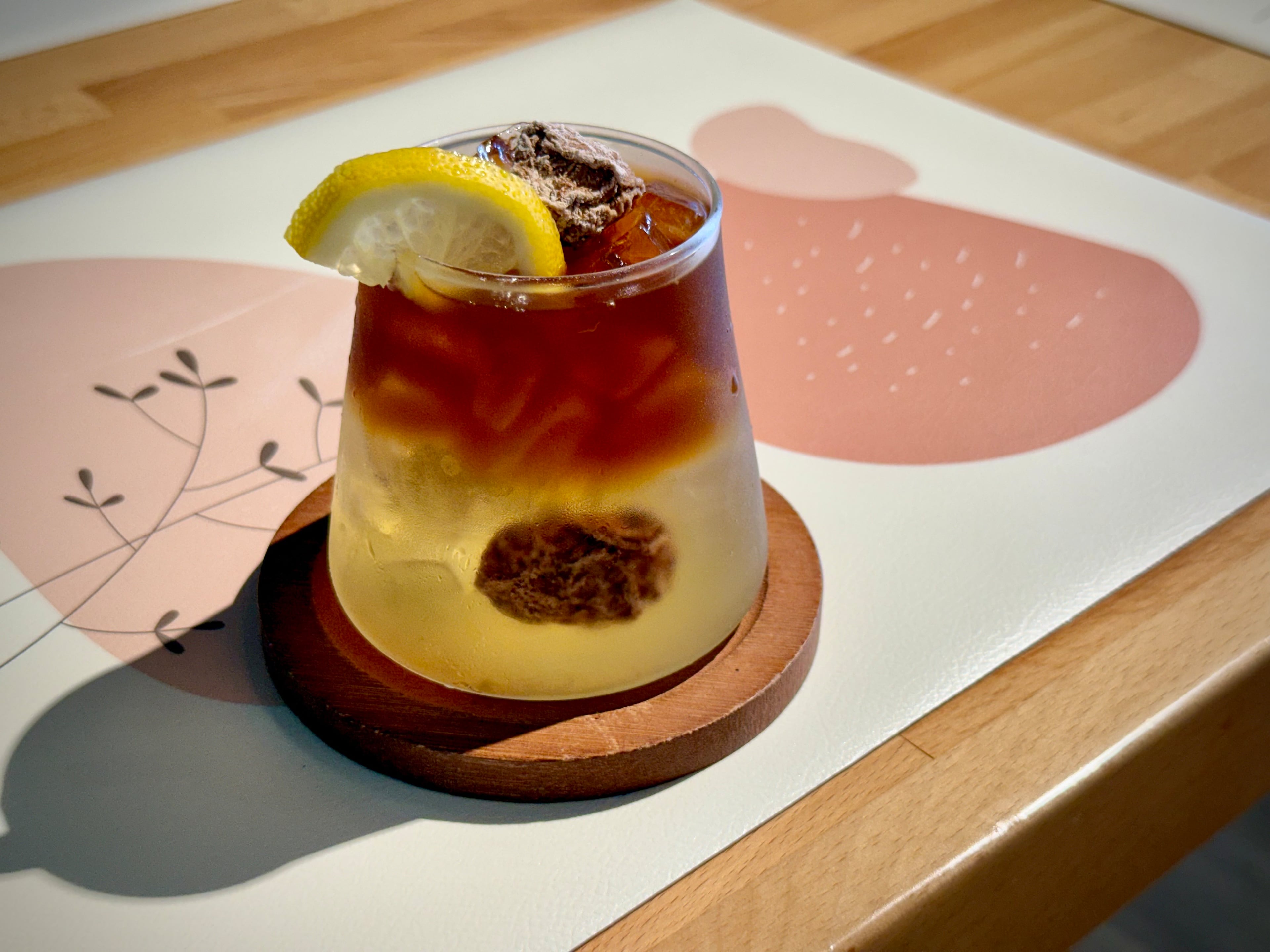 The lingering amber coffee drink at ScentTok Cafe in Johns Creek features cold brew, with jasmine and plum flavors. (Henri Hollis/AJC)