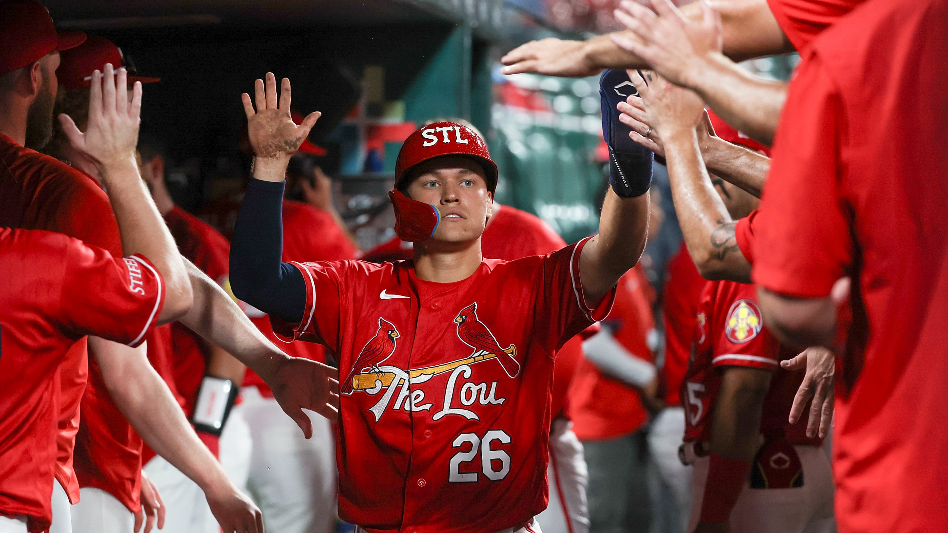 St. Louis Cardinals' JJ Wetherholt is congratulated by teammates after scoring a run during the sixth inning of a baseball game against the Atlanta Braves Friday, July 10, 2026, in St. Louis. (AP Photo/Scott Kane)
