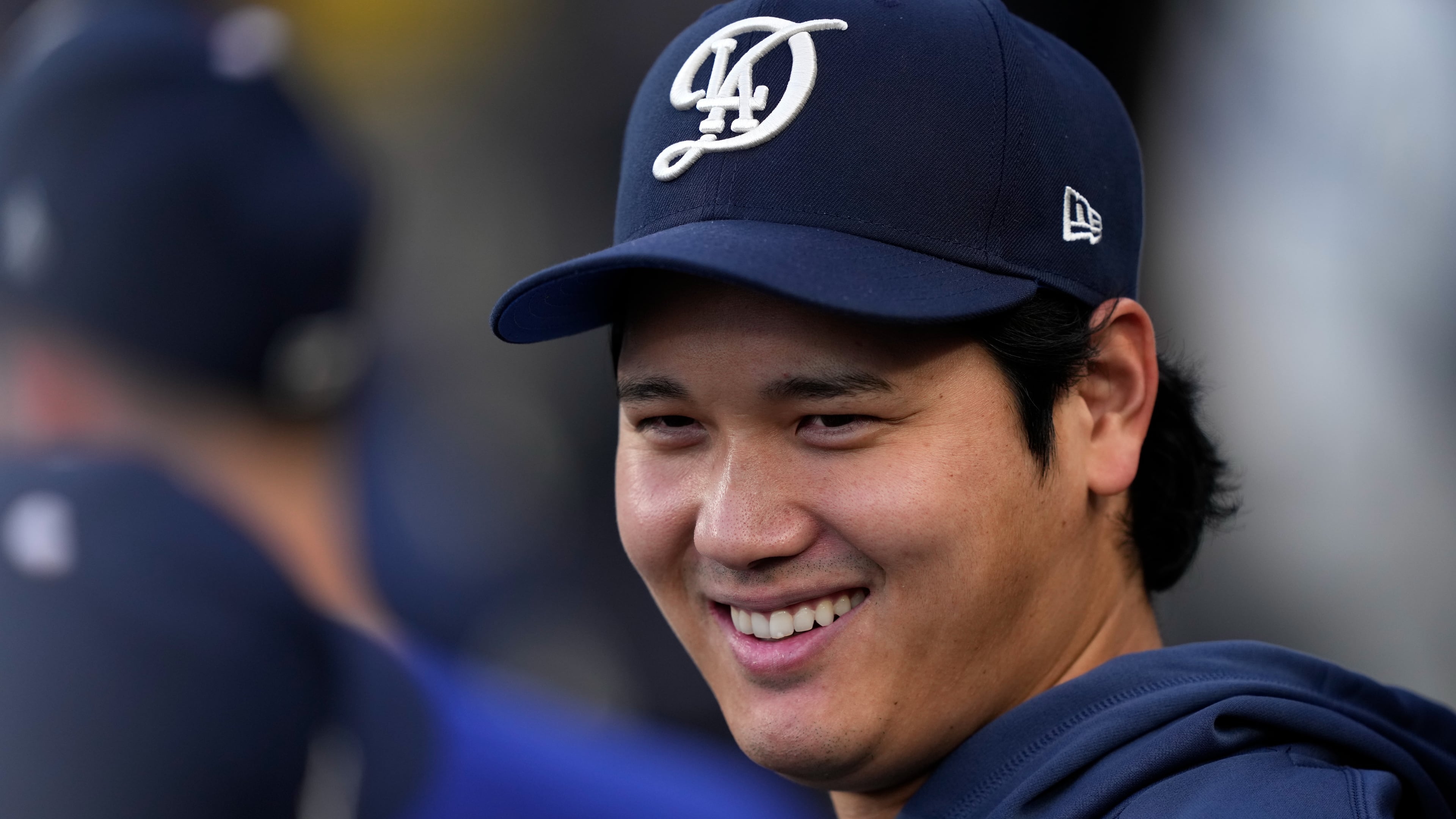 Los Angeles Dodgers' Shohei Ohtani smiles in the dugout during the first inning of a baseball game against the Washington Nationals, Saturday, Sept. 5, 2026, in Los Angeles. (AP Photo/Mark J. Terrill)