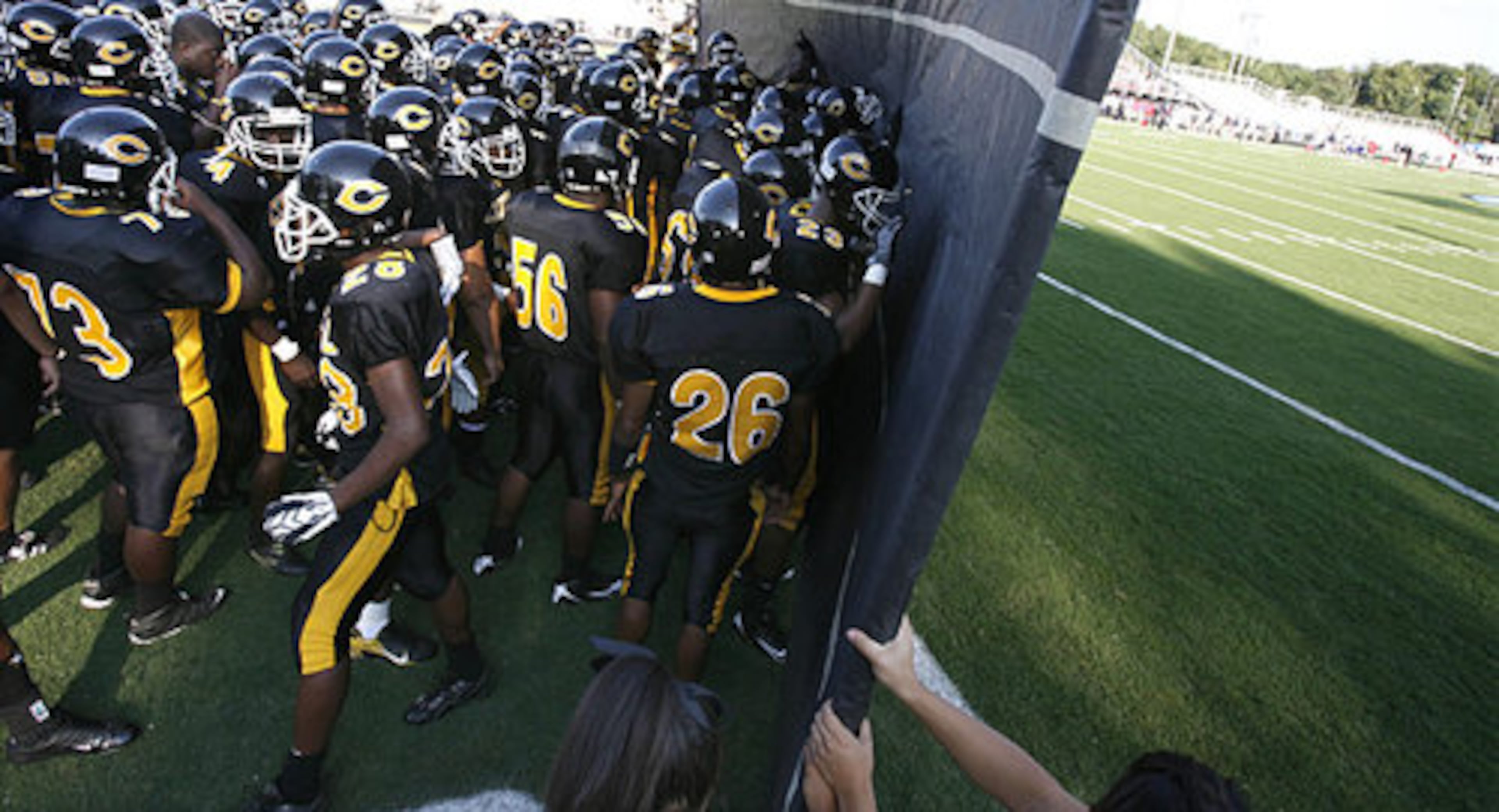 Central Gwinnett players prepare to take on visiting Mainland (Daytona Beach) at North Gwinnett High School.