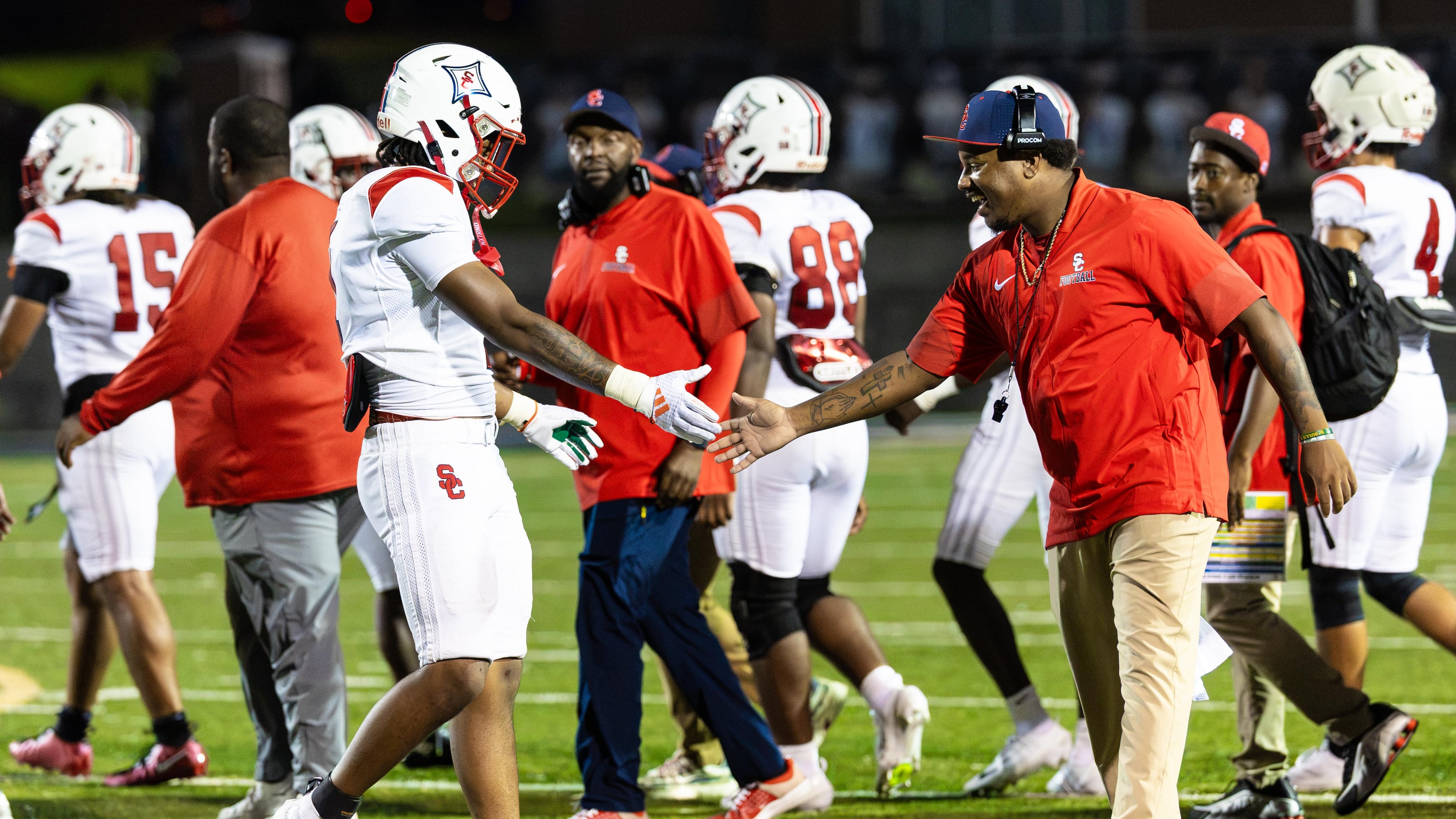 The Sandy Creek football team celebrates their victory over Douglas County at Douglas County High School in Douglasville, GA on Friday, August 28, 2026. (Oscar Guevara Saenz for the AJC)