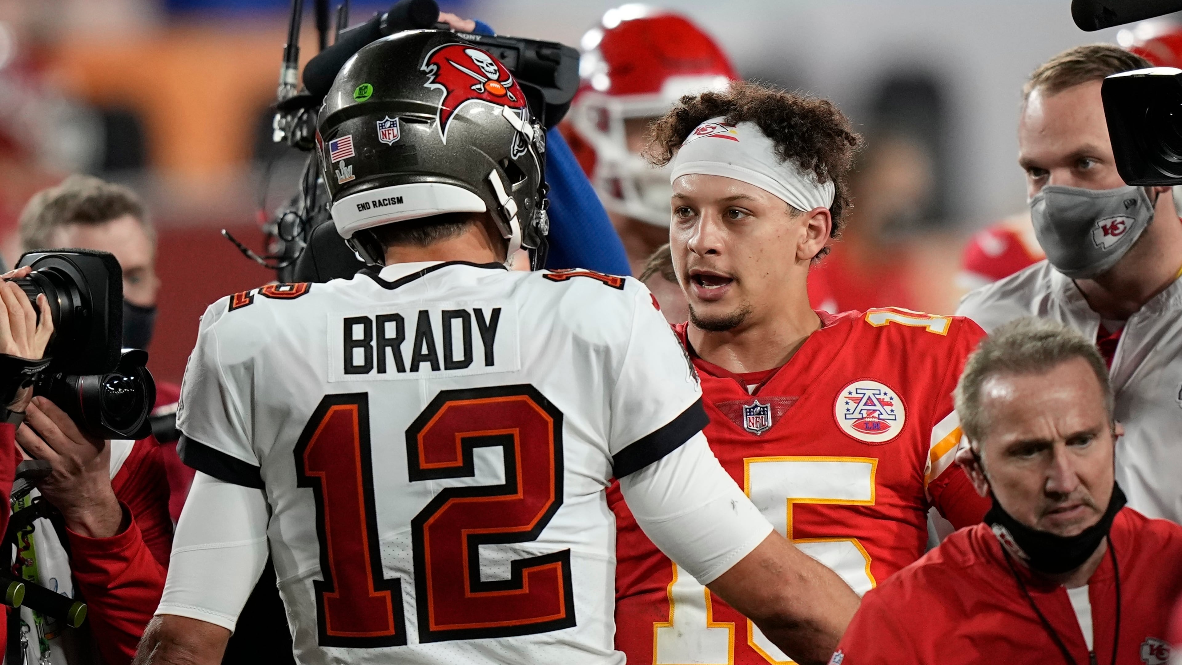 Tampa Bay Buccaneers quarterback Tom Brady speaks with Kansas City Chiefs quarterback Patrick Mahomes after Super Bowl 55 Sunday, Feb. 7, 2021, in Tampa, Fla. The Buccaneers defeated the Chiefs 31-9 to win the Super Bowl. (David J. Phillip/AP)
