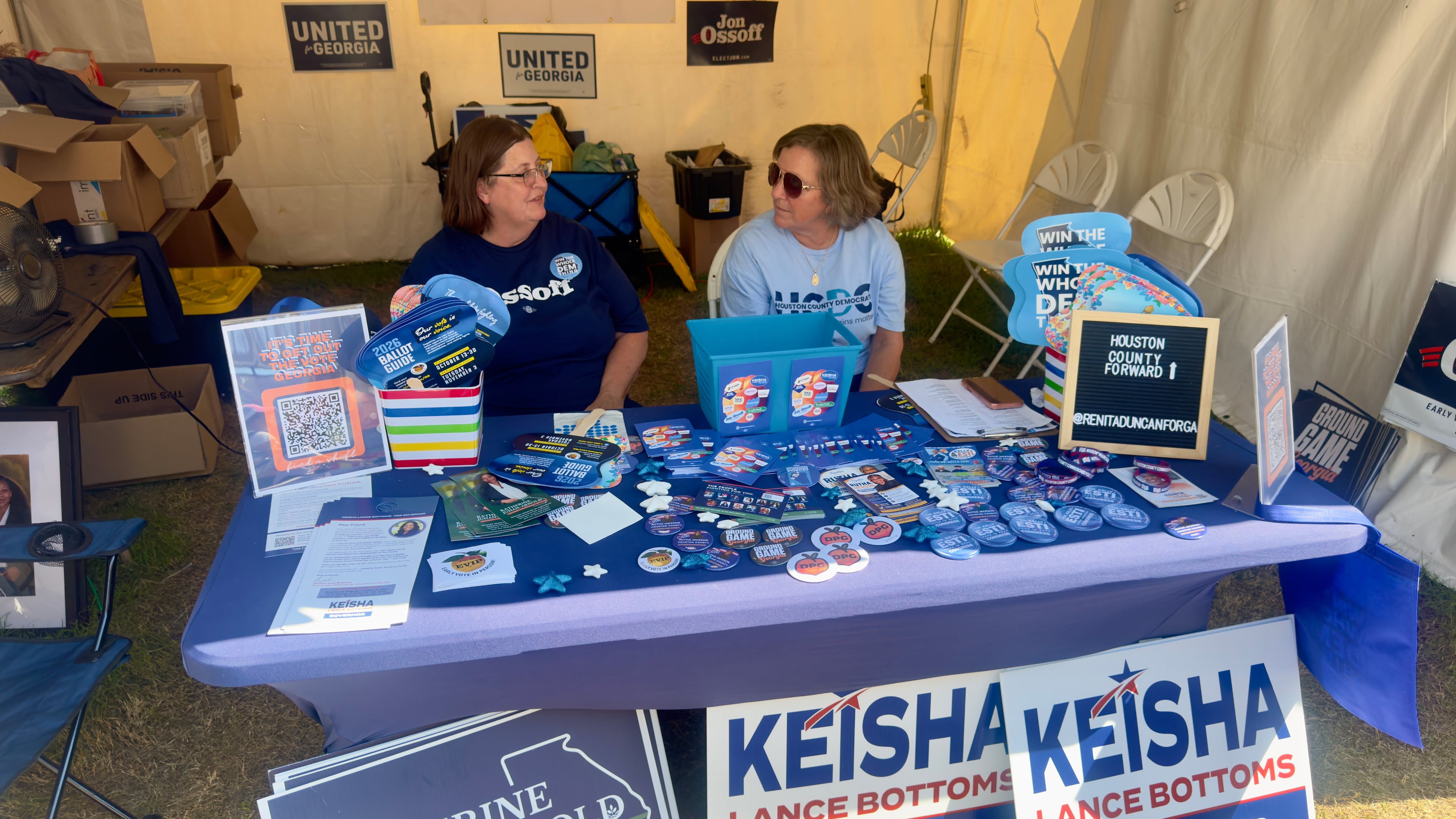 Volunteers staff a booth run by the Houston County Democratic Committee at the Georgia National Fair in Perry. (Joe Kovac Jr./AJC)