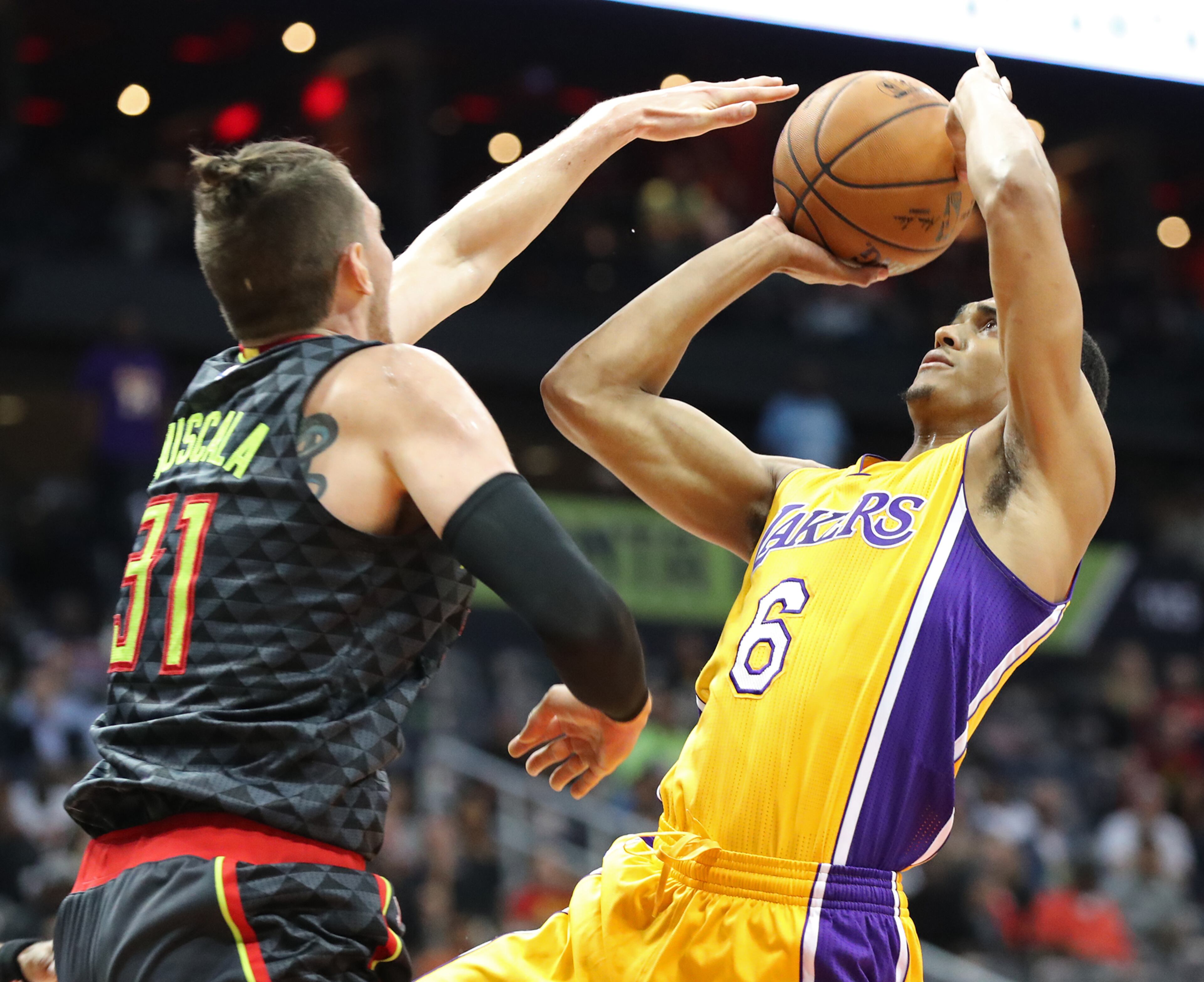 November 2, 2016, ATLANTA: Lakers Jordan Clarkson gets off a shot against Mike Muscala during the second half in an NBA basketball game at Philips Arena on Wednesday, Nov. 2, 2016, in Atlanta. Curtis Compton /ccompton@ajc.com