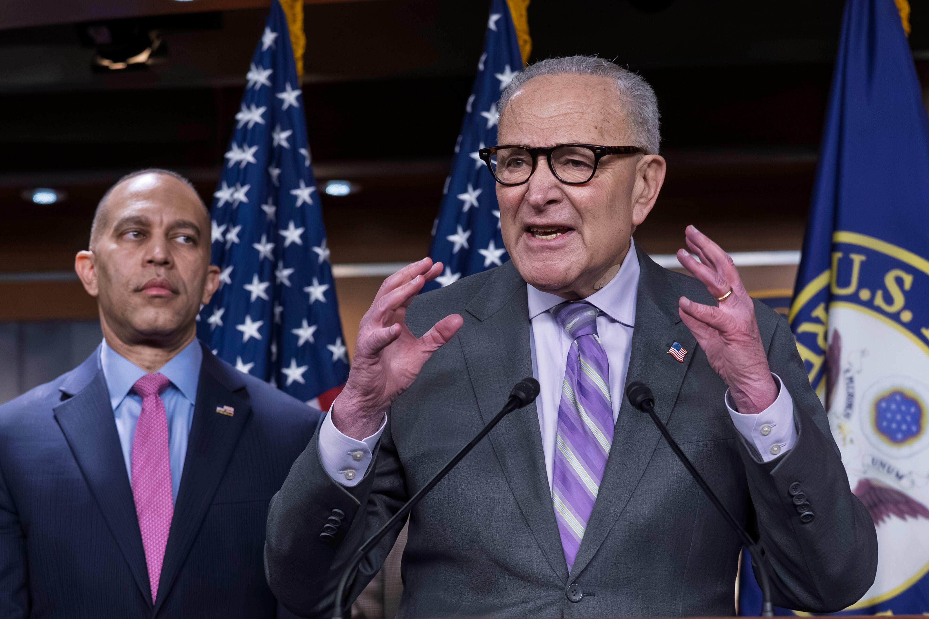 Senate Minority Leader Chuck Schumer (right) spoke at a recent news conference in Washington as House Minority Leader Hakeem Jeffries listened. Both are Democrats from New York. (J. Scott Applewhite/AP)