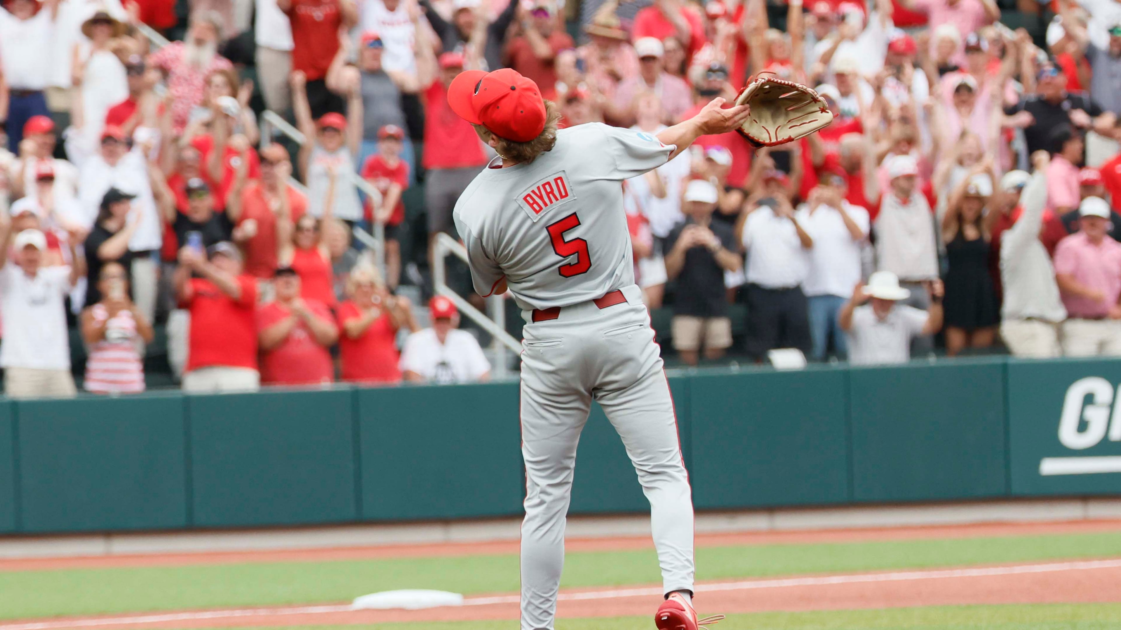 Georgia Bulldogs pitcher Justin Byrd tosses his glove to celebrate striking out the last Mississippi State batter during the 10th inning to secure the NCAA Super Regional victory Sunday, June 7, 2026. (Miguel Martinez/AJC)