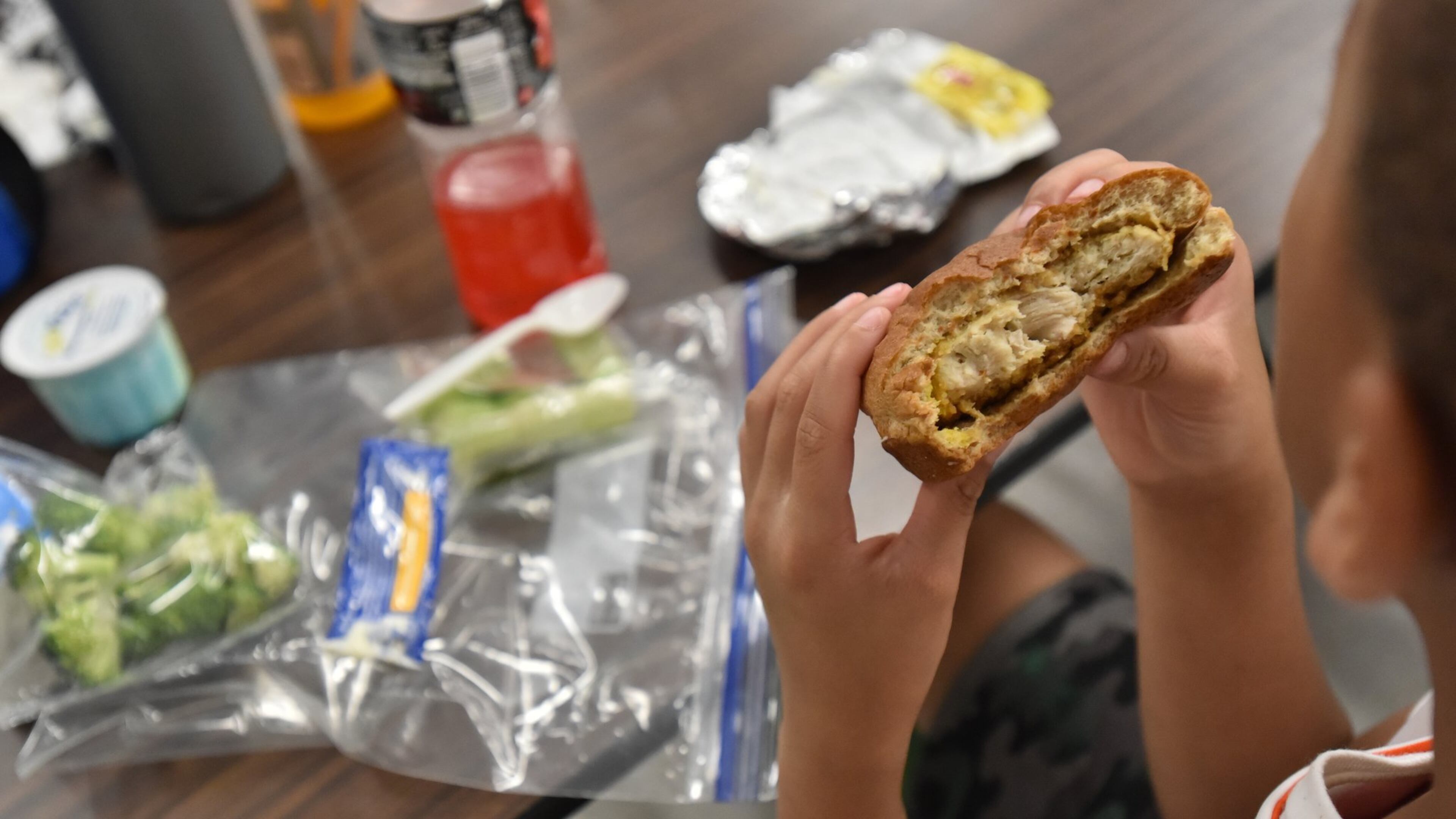 A student eats his lunch during summer camp at Campbell Middle School in Smyrna. School is over and that means many students run the risk of going hungry. Without schools providing meals — sometimes twice a day — some students won’t have the food at home. HYOSUB SHIN / HSHIN@AJC.COM