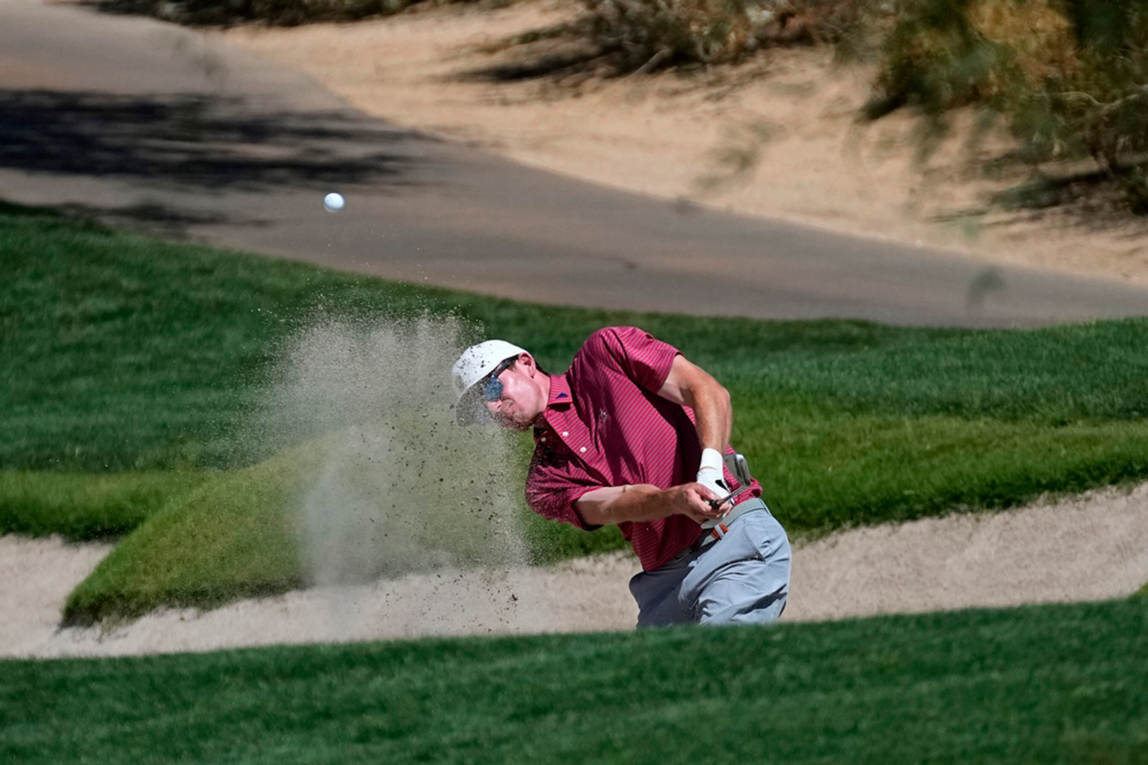 Alabama golfer Nick Dunlap his from the sand along the 15th fairway during the final round of the NCAA college men's stroke play golf championship, Monday, May 29, 2023, in Scottsdale, Ariz. (AP Photo/Matt York)