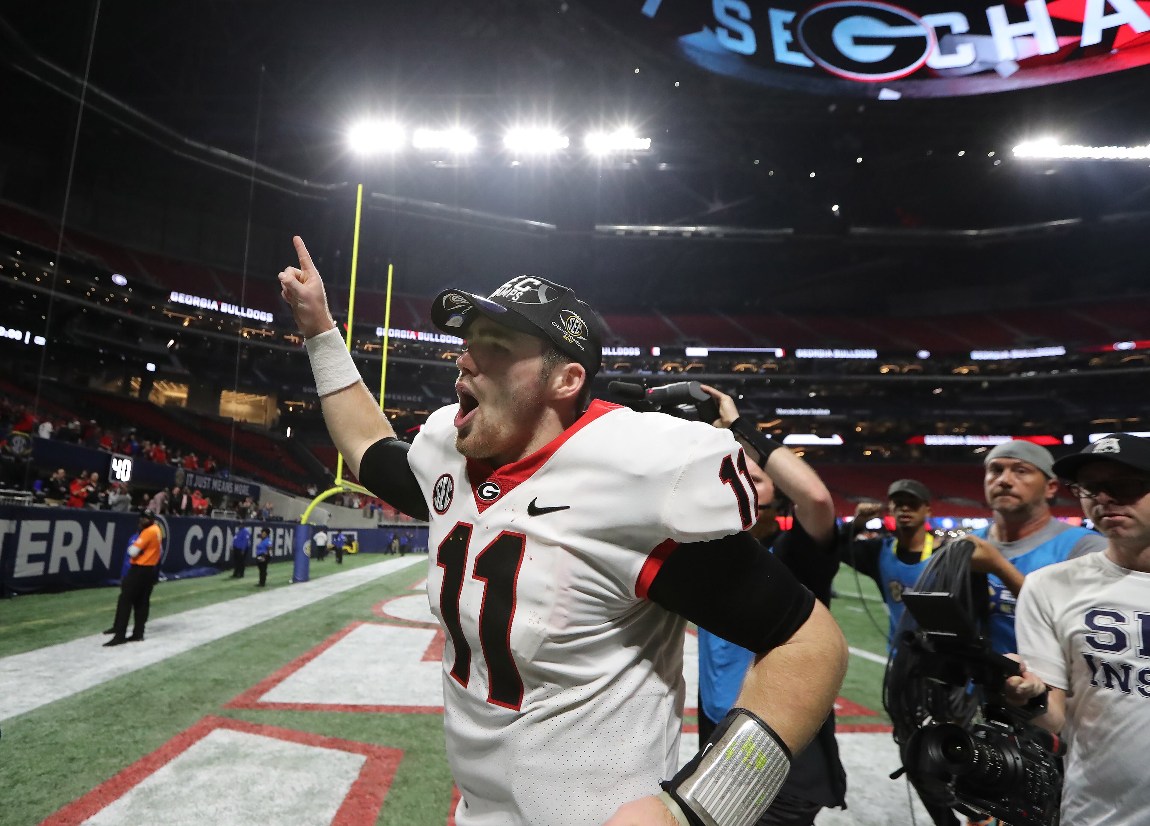 December 2, 2017 Atlanta: Georgia Bulldogs quarterback Jake Fromm (11) runs off the field following the SEC Football Championship at Mercedes-Benz Stadium, December 2, 2017, in Atlanta. Georgia defeated Auburn 28-7. Curtis Compton / ccompton@ajc.com