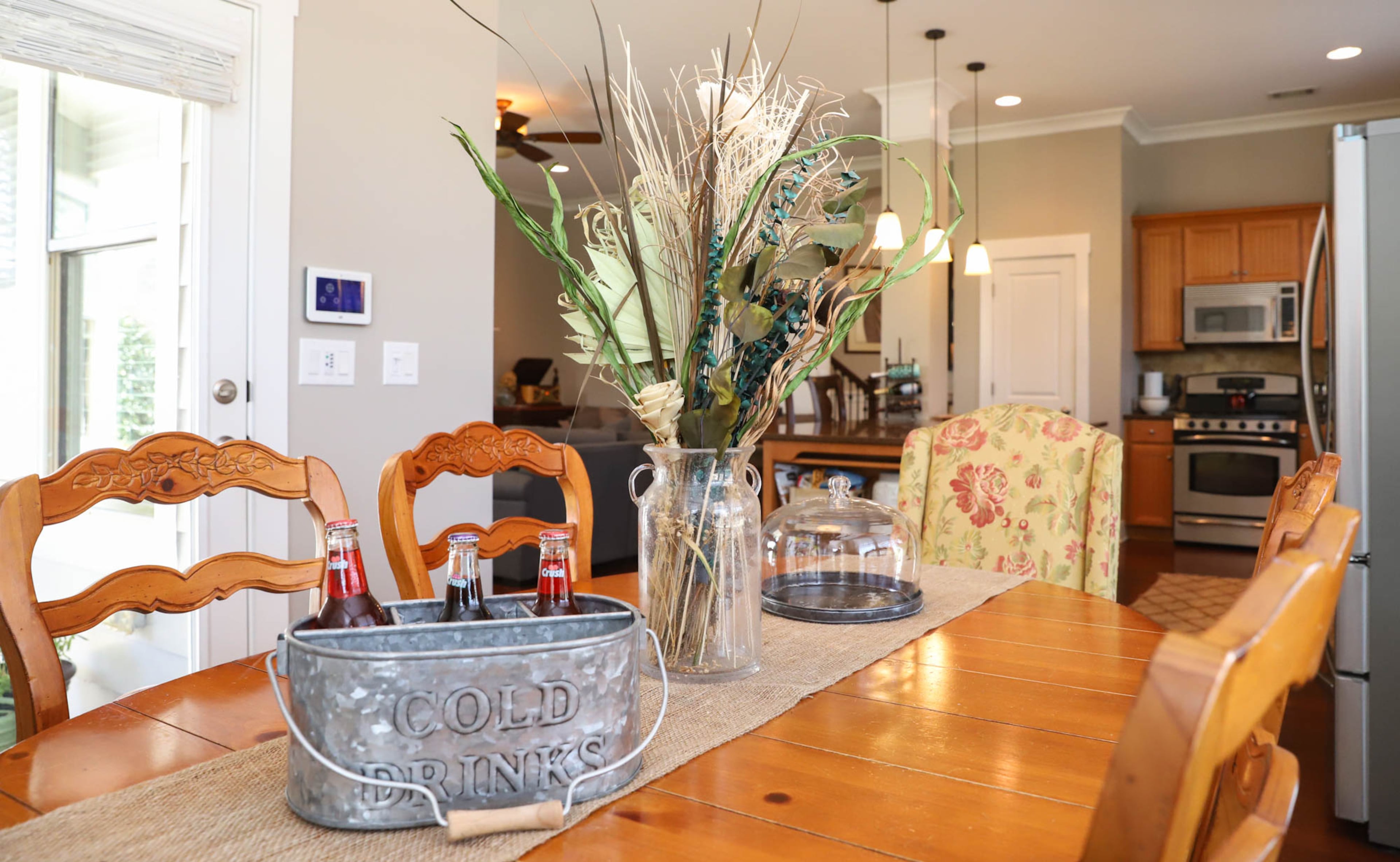 The kitchen table and wooden chairs in the breakfast nook of Gail Burns-Grant’s home are from Havertys. Burns-Grant found the upholstered chairs at The Rustic Market and had them reupholstered to match her warm and traditional decor. Text by Shannon Dominy/Photo by Reynolds Rogers