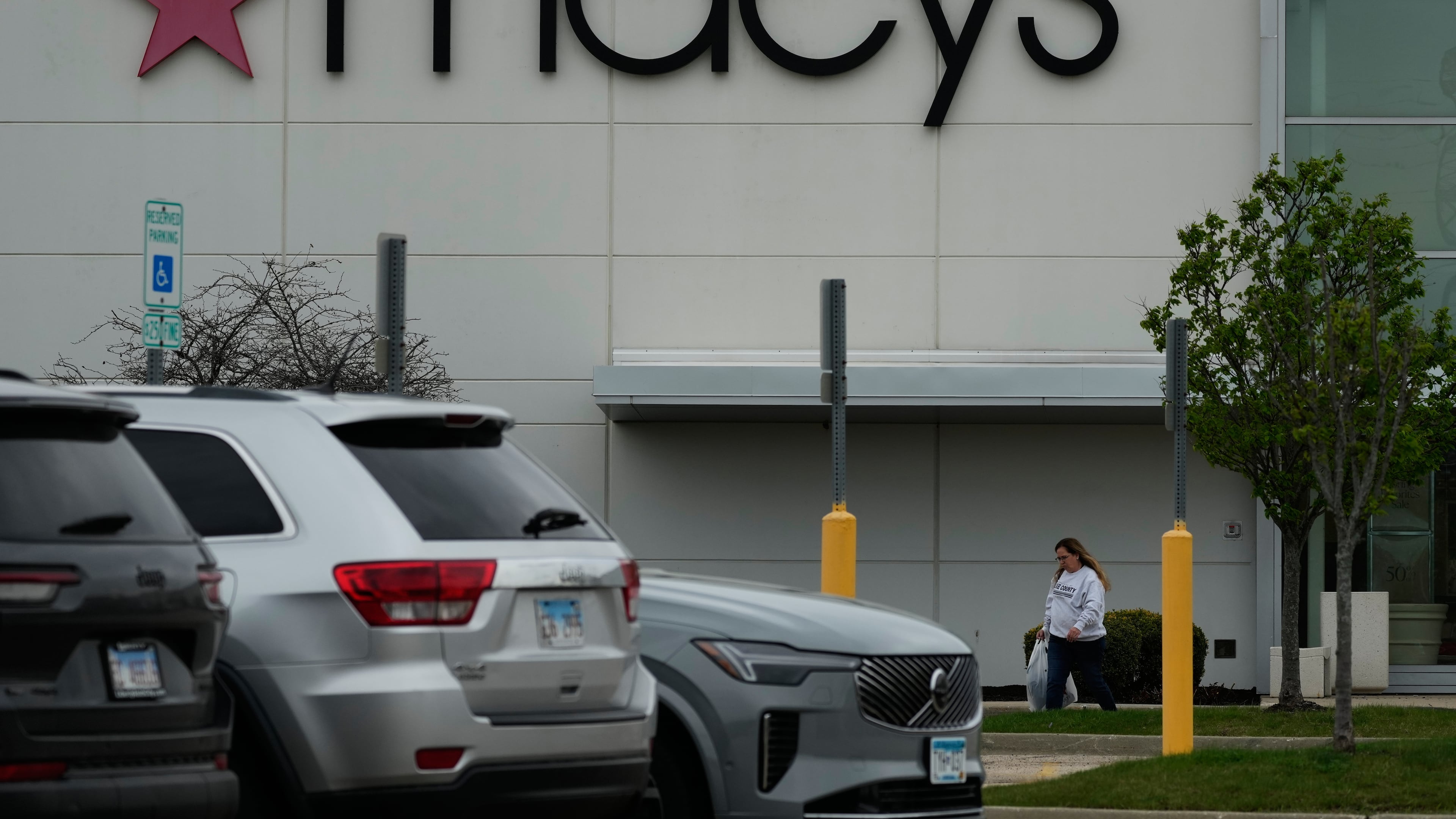 FILE - A Macy's sign is displayed outside the department store in Gurnee, Ill., Wednesday, April 15, 2026. (AP Photo/Nam Y. Huh, file)