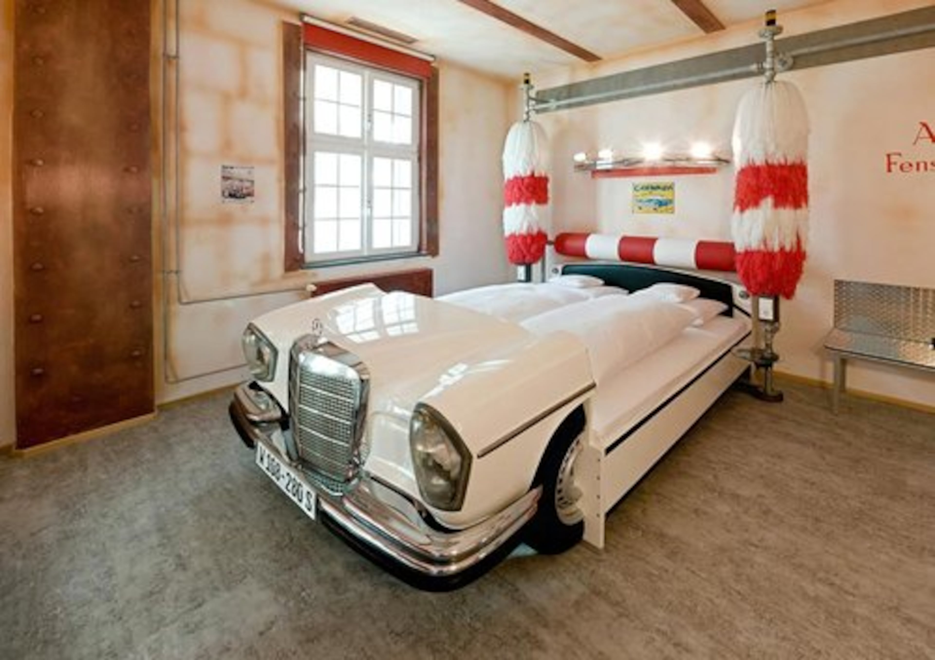 The carwash room is outfitted with good, clean fun. Check out the brush and roller headboard of the bed.