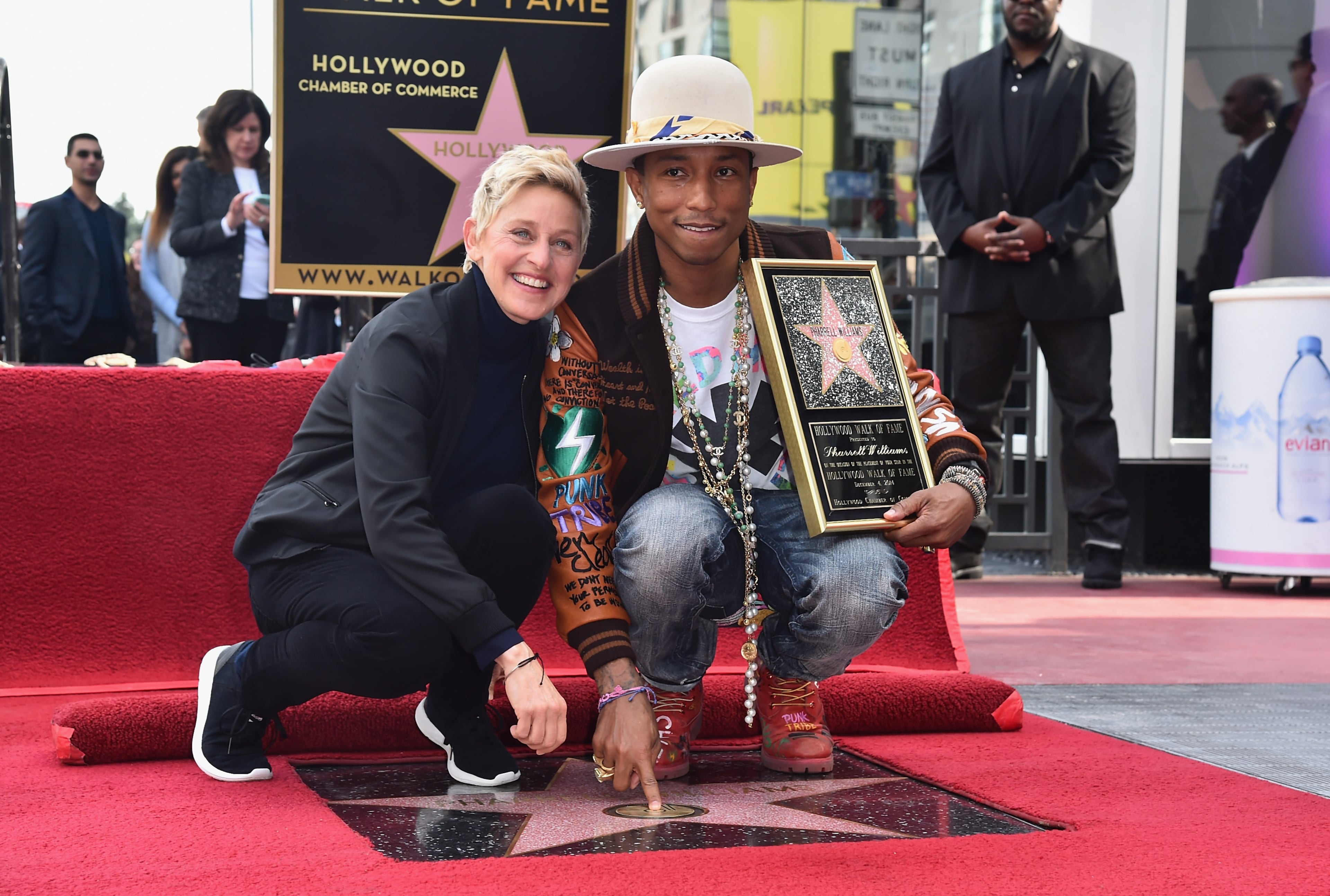 HOLLYWOOD, CA - DECEMBER 04: TV host Ellen Degeneres and singer/producer Pharrell Williams attend a ceremony honoring Pharrell Williams with the 2,537th Star on The Hollywood Walk of Fame on December 4, 2014 in Hollywood, California. (Photo by Alberto E. Rodriguez/Getty Images)