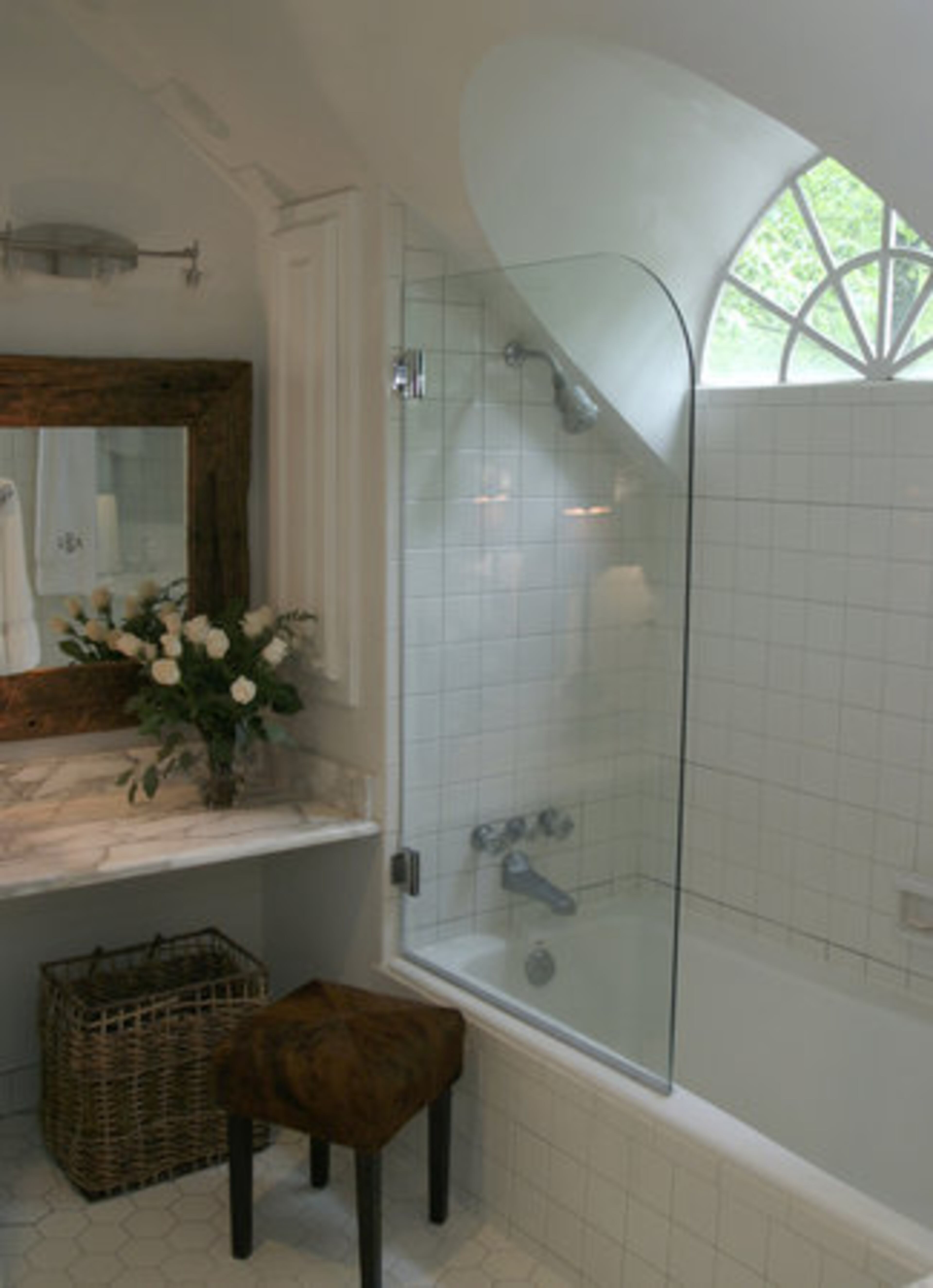 Mary redesigned the master bath with Carrera marble, a driftwood mirror and a European-style shower door.