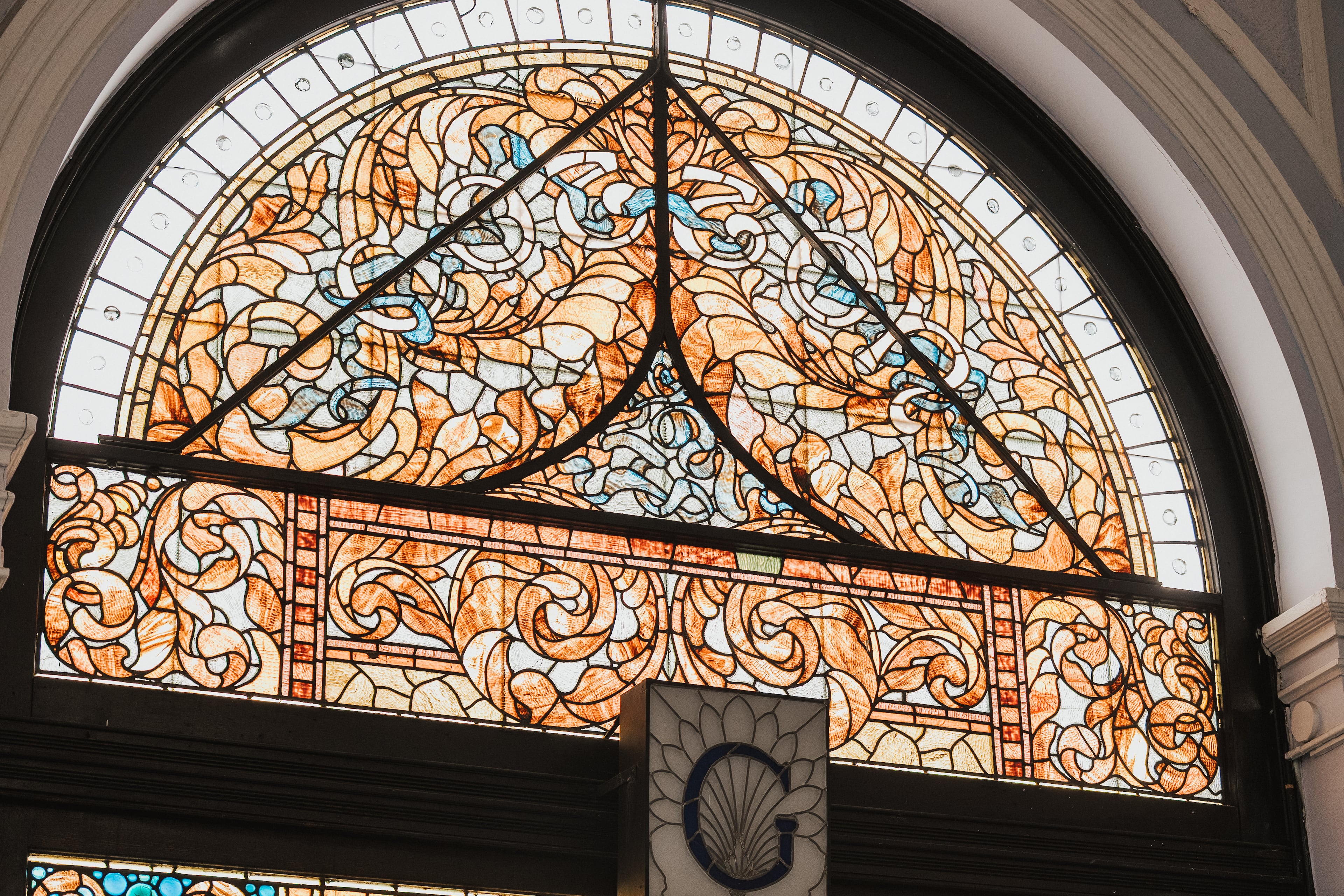 A stained-glass window is among the historic features of the 19th-century Cotton Exchange building in Savannah, Georgia. (Courtesy of Andrew Frazier/Engels and Völkers)