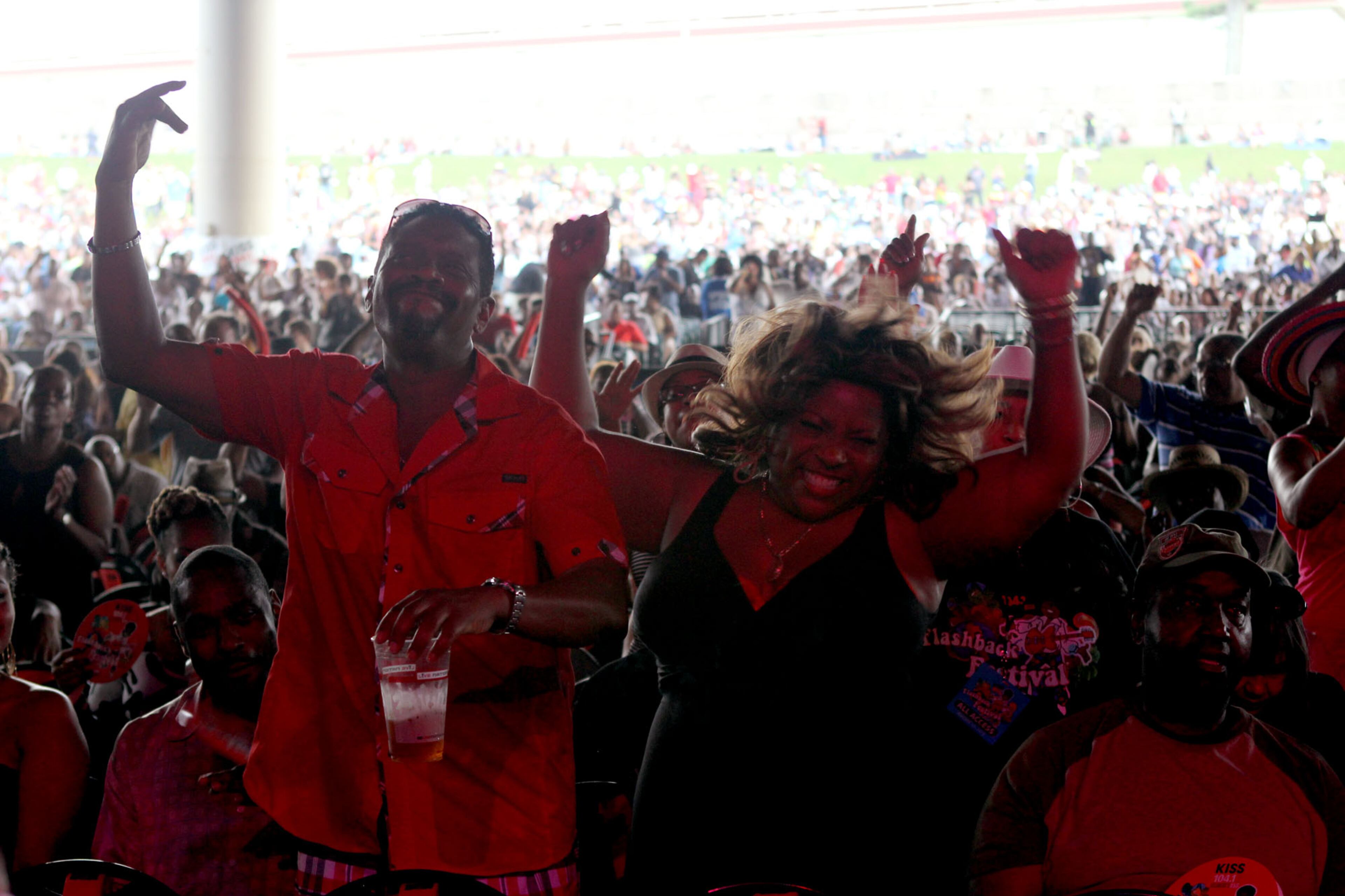 Fans party to the music of Brick during the 2013 Flashback Festival at Aaron's Amphitheatre at Lakewood in Atlanta on Saturday.