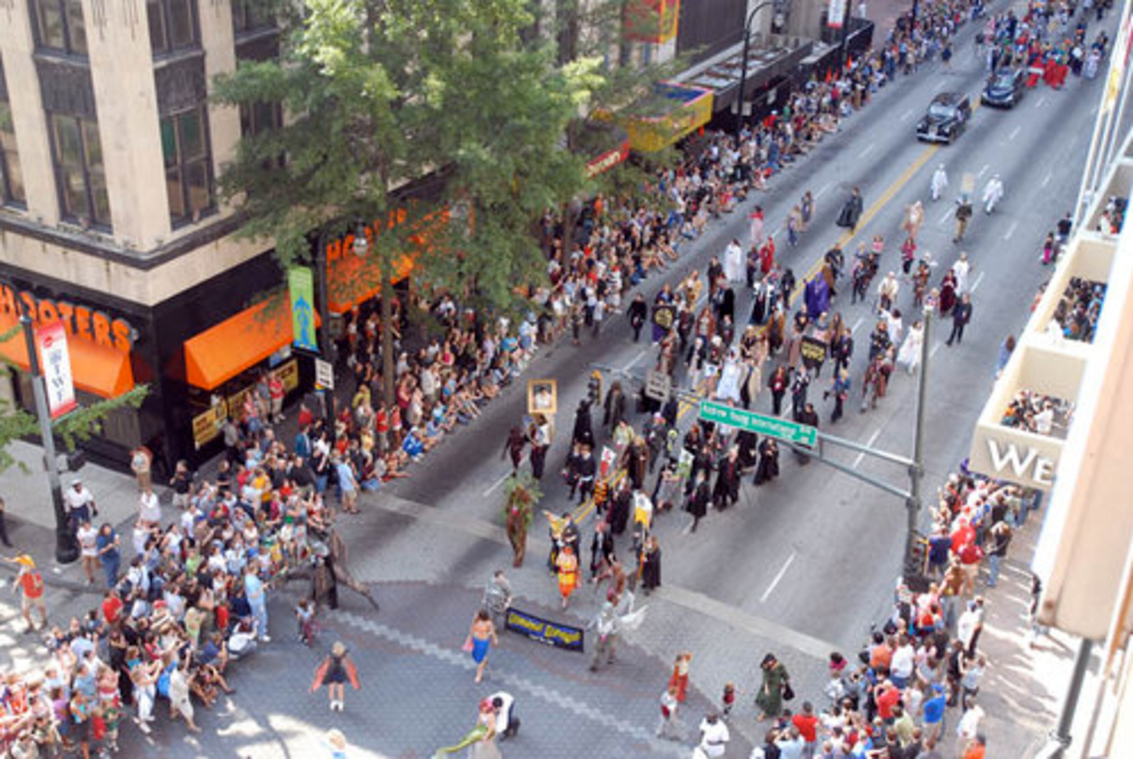 The Dragon*Con parade makes its way North on Peachtree Street.