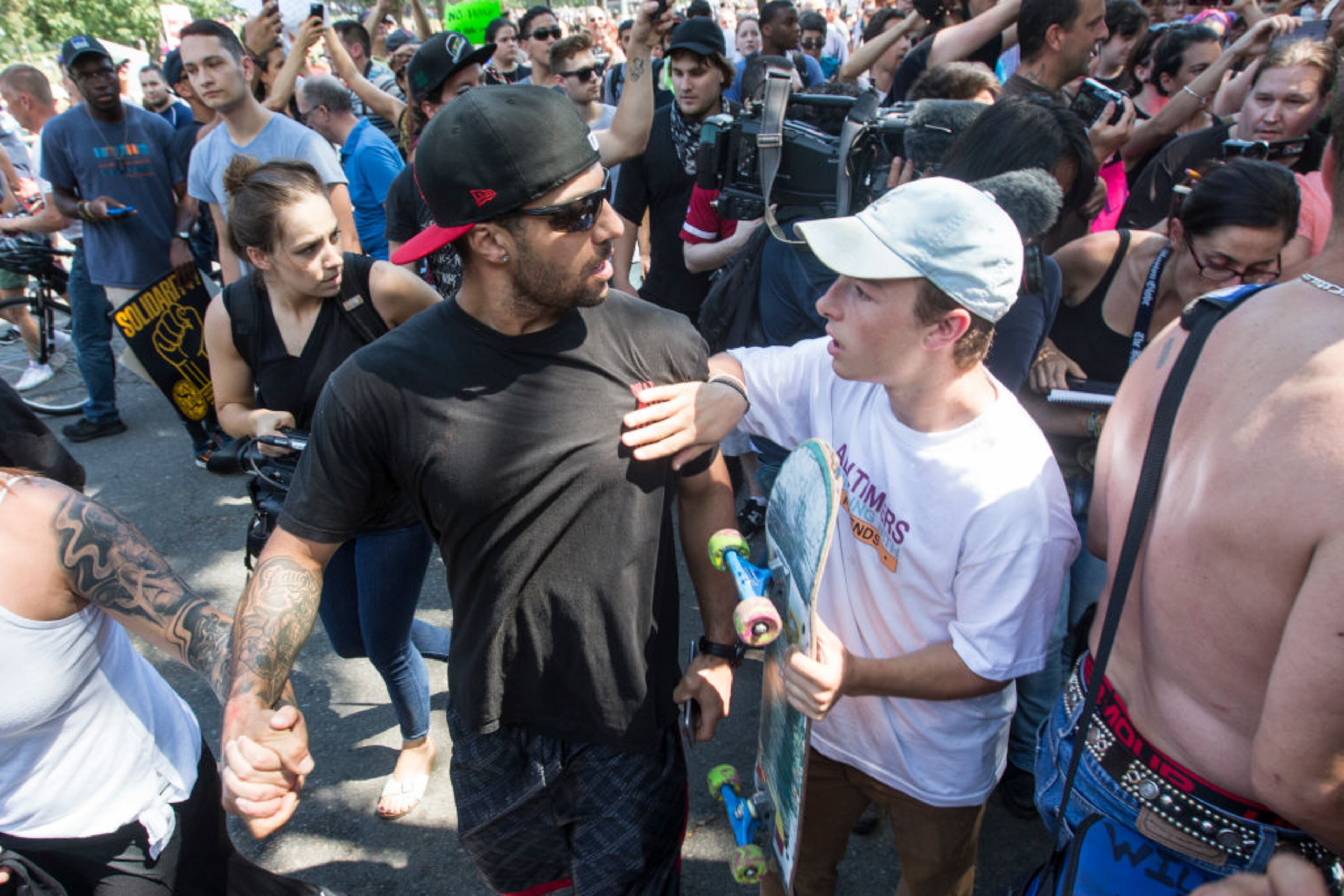 BOSTON, MA - AUGUST 19: A counter protester argues with a man after a march to the 'Free Speech Rally' on Boston Common on August 19, 2017 in Boston, Massachusetts. Thousands of demonstrators and counter-protestors are expected at Boston Common where the Boston Free Speech Rally is being held. (Photo by Scott Eisen/Getty Images)