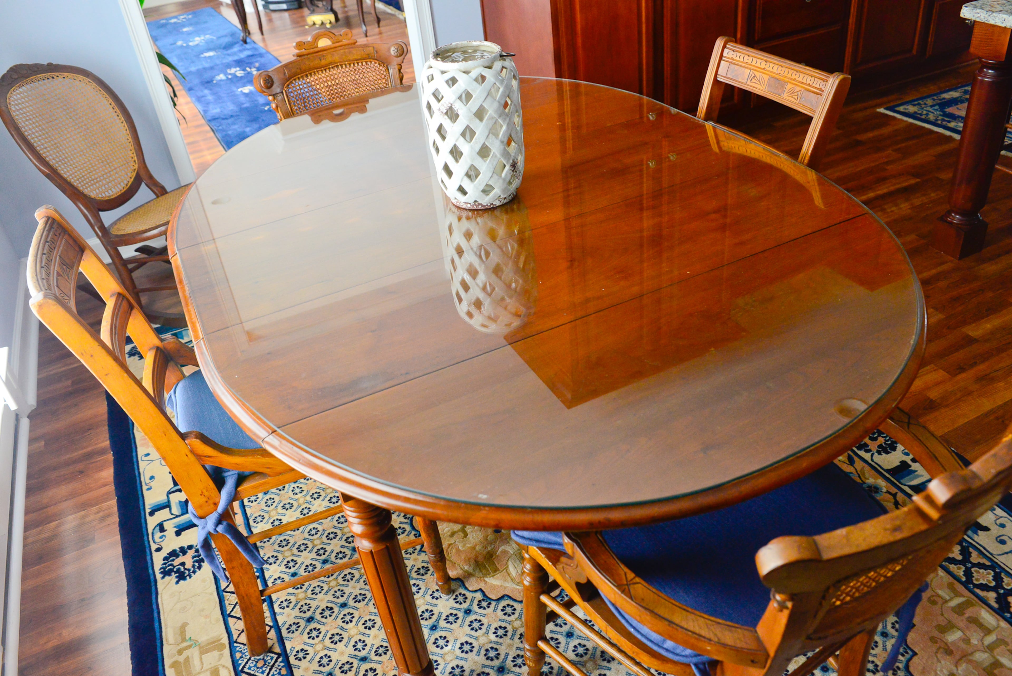 An antique table, passed down to Linda and Chris from Chris' grandmother, sits at the heart of the eat-in kitchen. The couple uses the heirloom for family meals and smaller gatherings.