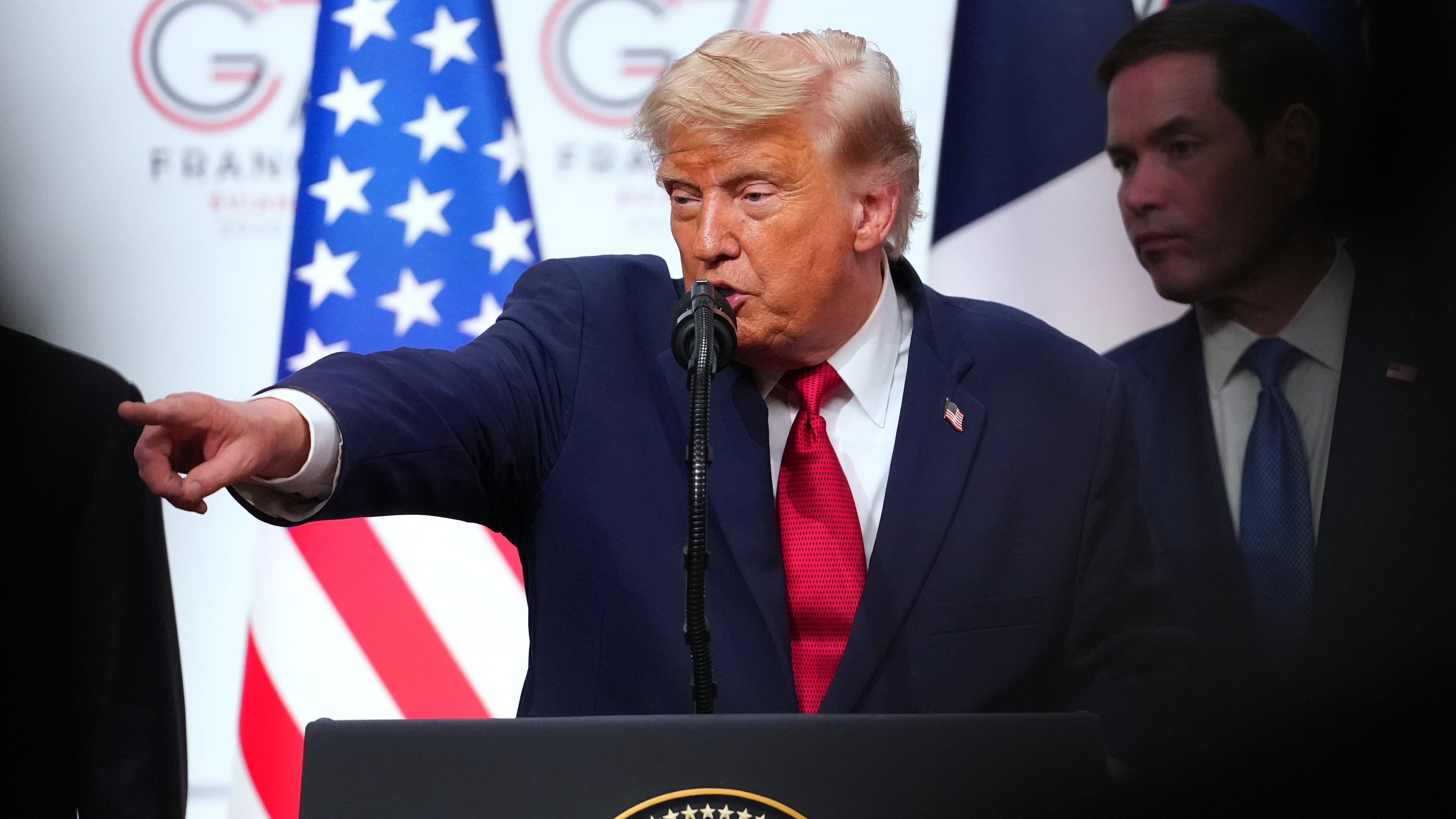 U.S. President Donald Trump, center, takes questions during a media conference at the end of the G7 summit in Evian-les-Bains, France, Wednesday, June 17, 2026. (AP Photo/Vadim Ghirda)