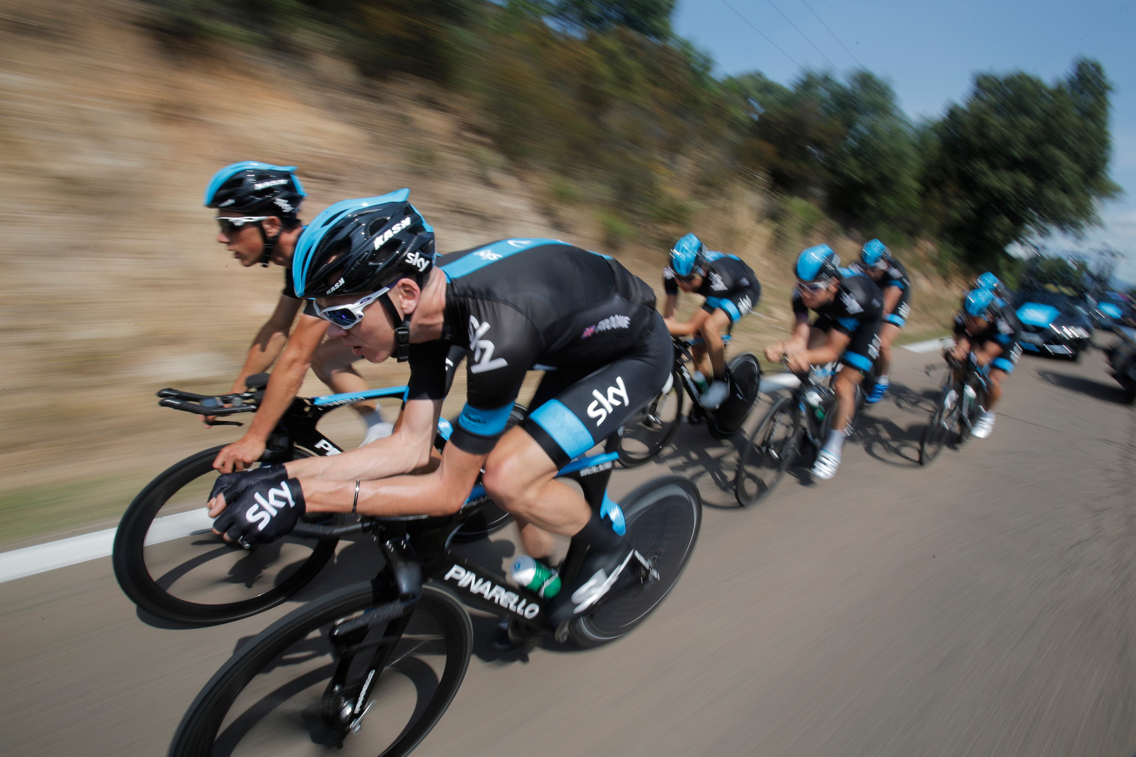 Britain's Christopher Froome, front, rides with his teammates during a training in Porto Vecchio, southern Corsica island, France, Thursday June 27, 2013. The race starts in Porto Vecchio on Saturday June 29, and the 198-rider peloton, or pack, is to cover 3,479 kilometers (2,162 miles) over three weeks, 21 stages and two rest days, before an unusual nighttime finish July 21 on the Champs-Elysees in Paris. (AP Photo/Christophe Ena)