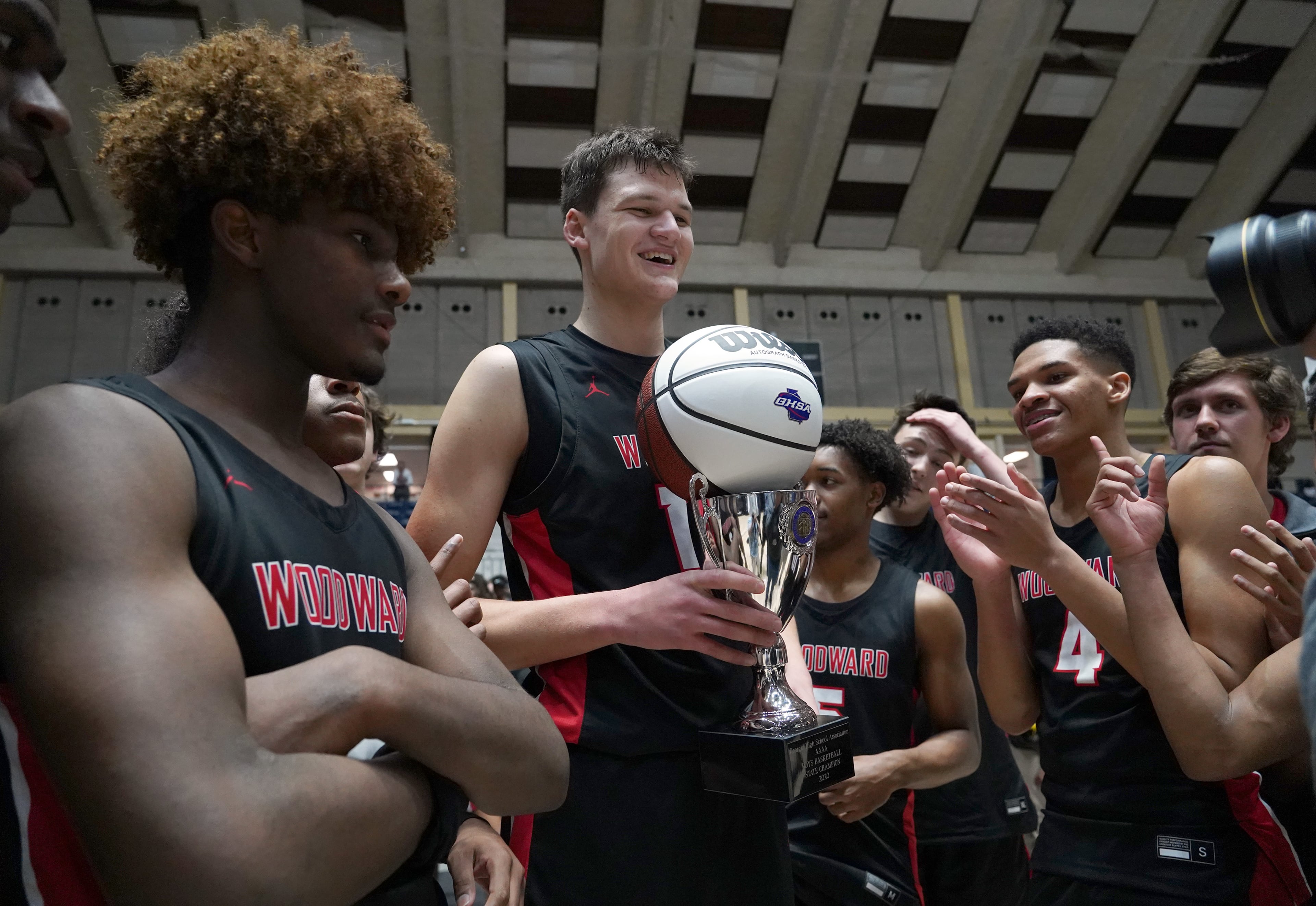 Woodward Academy's Walker Kessler (13) celebrates with teammates after their win over Cross Creek of the Class AAAA boys title basketball game at the Macon Centreplex, Friday March 6, 2020, in Macon. Tami Chappell for the Atlanta Journal Constitution