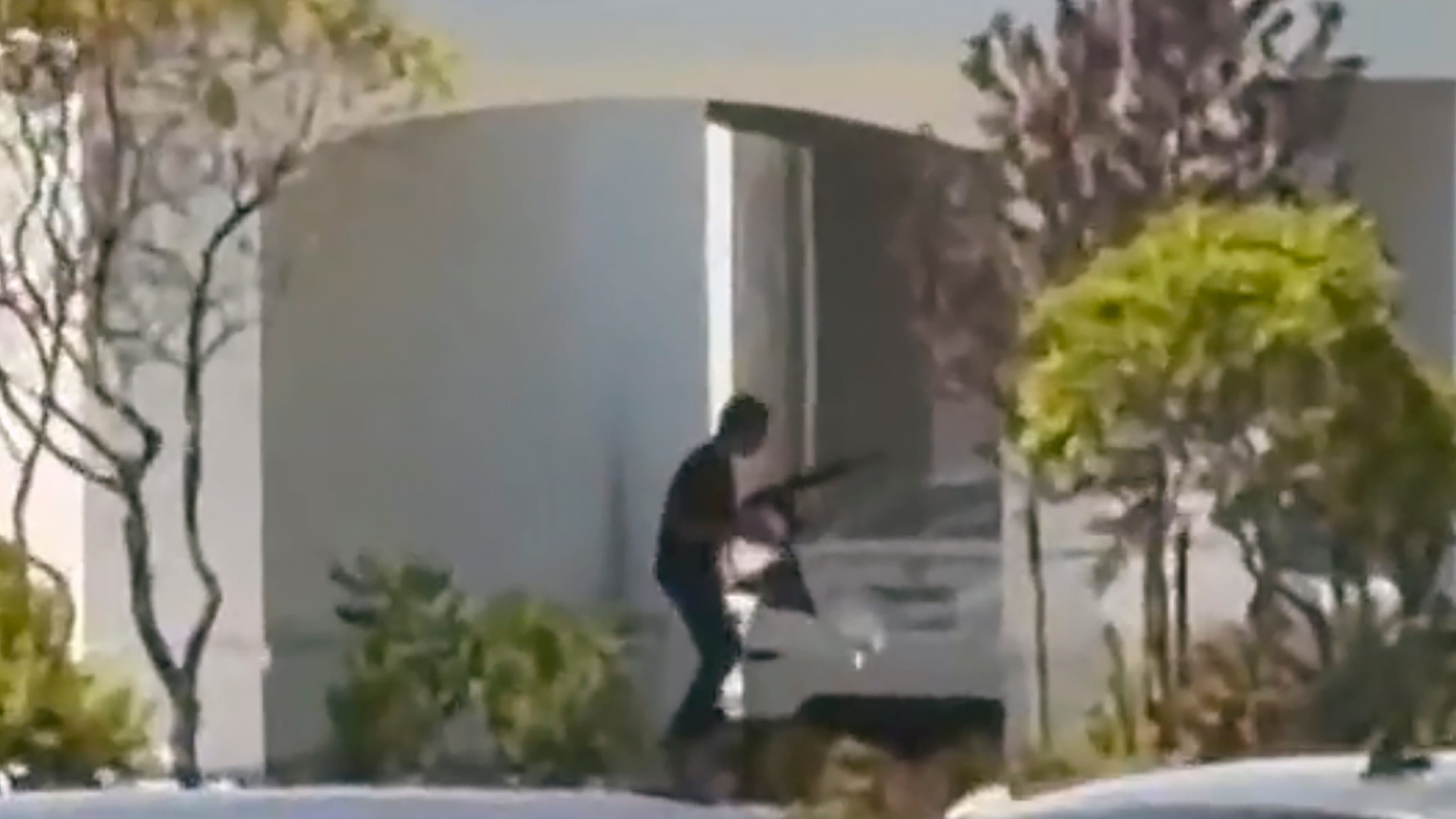 This still image captured from video by a witness shows the scene of a shooting that started at an In-N-Out Burger restaurant, Saturday, Aug. 1, 2026 in Twin Falls, Idaho. (Kevin Bell Jr. via AP)