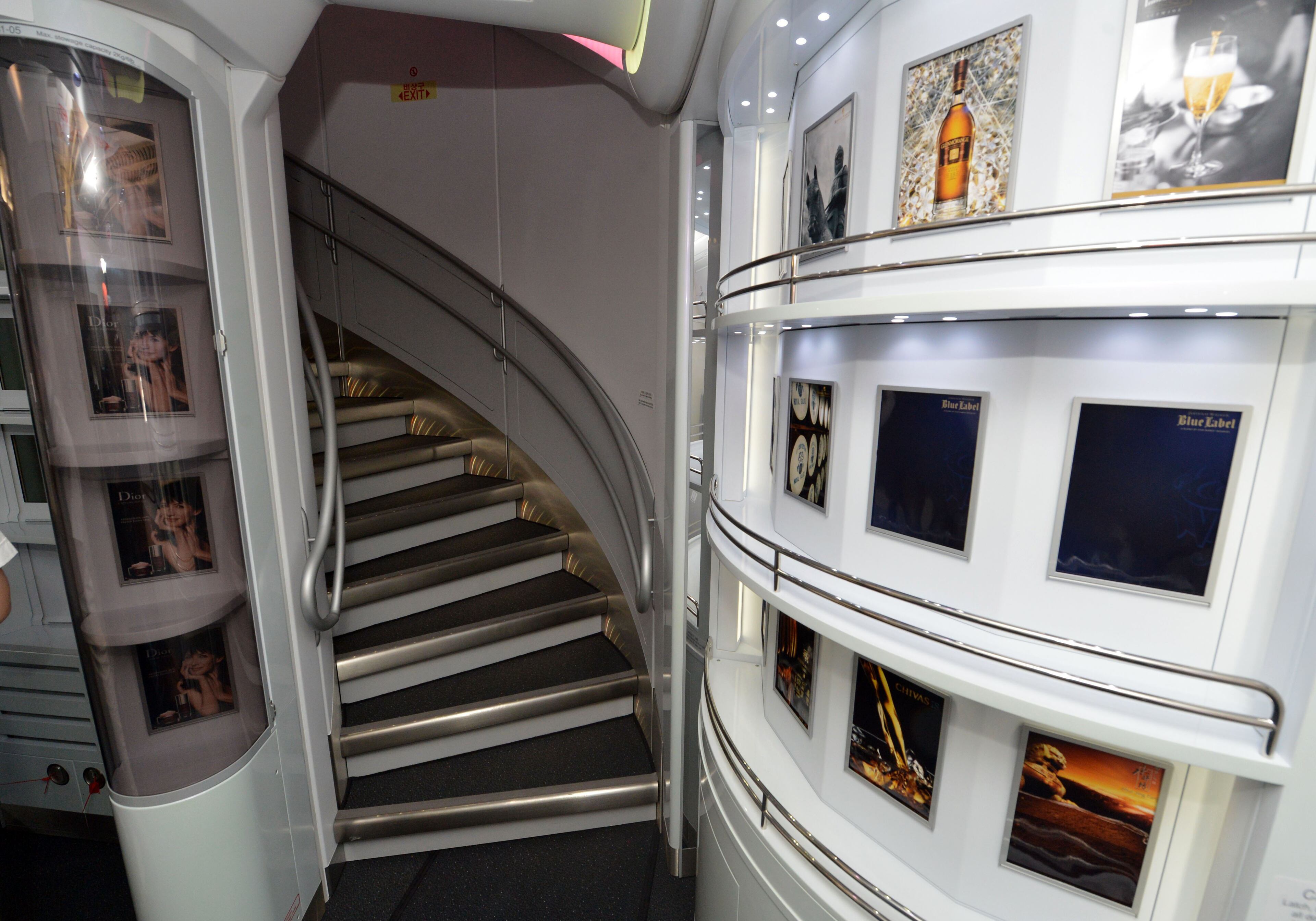 A circular staircase from the upper deck descends into the Sky shop area. of Korean Air's Airbus A380, the world's largest passenger aircraft. KENT D. JOHNSON / KDJOHNSON@AJC.COM
