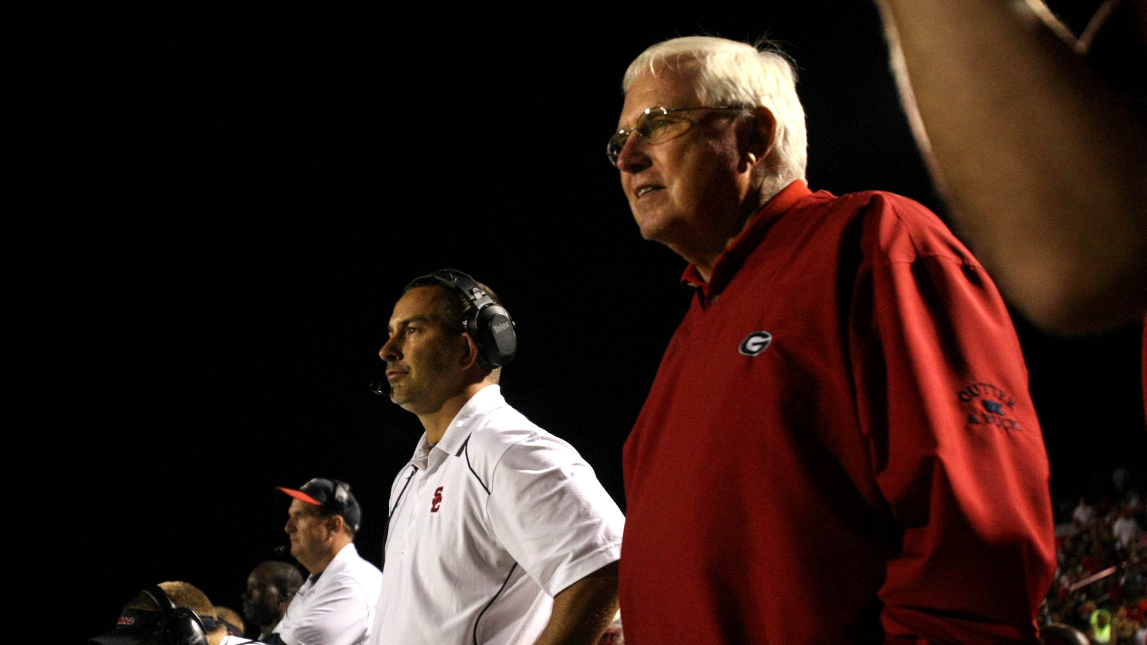 Sandy Creek coach Chip Walker (center) and former Sandy Creek coach and Chip's father Rodney Walker (right) stand next to each other on the sideline during Sandy Creek's win over Eastside at Sandy Creek H.S. Friday night in Tyrone, Ga., Oct. 01, 2010. Sandy Creek is ranked No. 2 in Class AAA. Rodney and his son Chip are the only father son in Georgia state history to both win football state championships as head coaches. (Jason Getz/AJC)