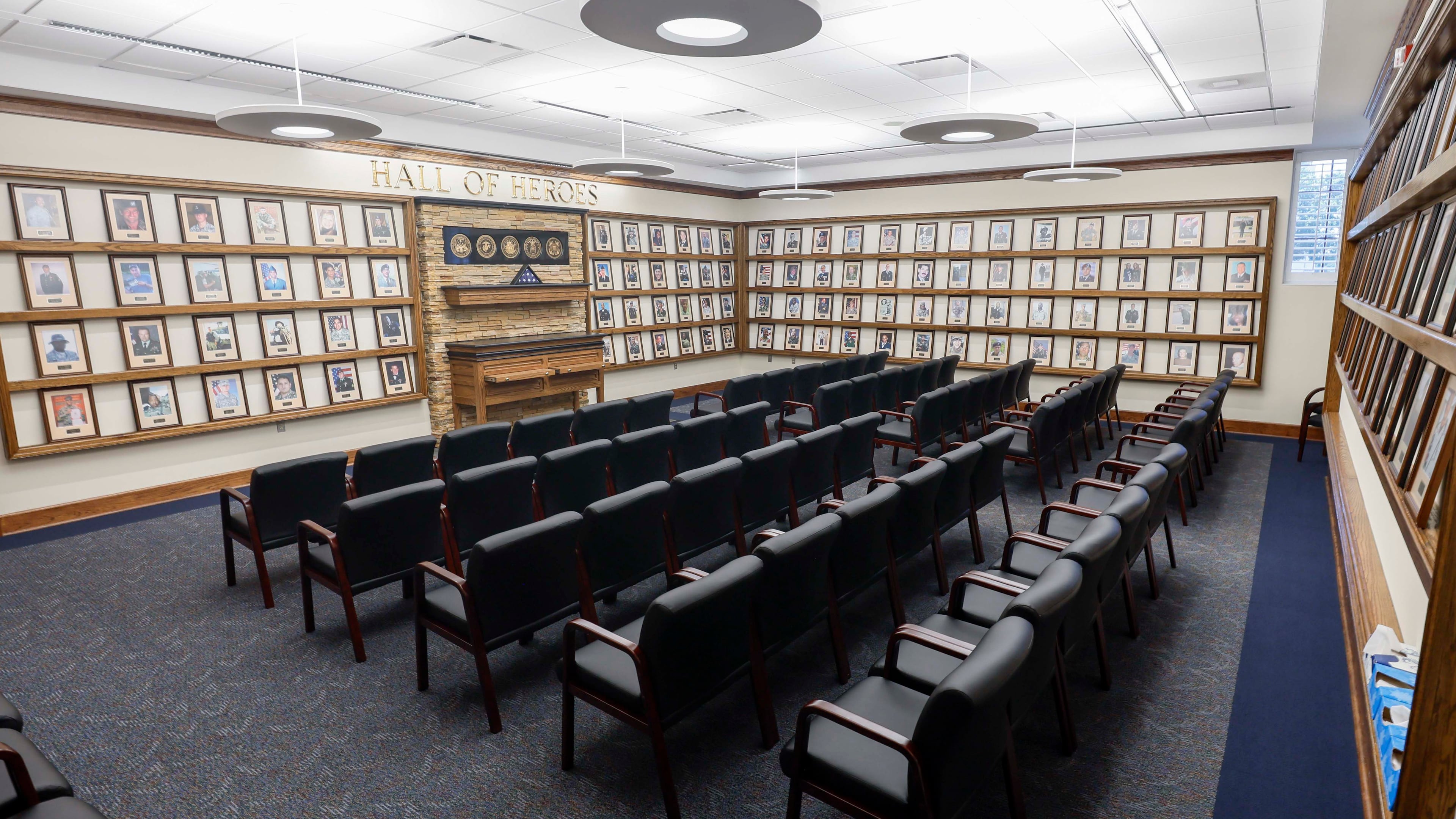 Photographs honoring deceased members of the military line the walls of the Hall of Heroes at Fort Benning. The hall was established in 2011 when the Georgia army base opened a dedicated Survivor Outreach Center to support the families of fallen soldiers. (Miguel Martinez/AJC)