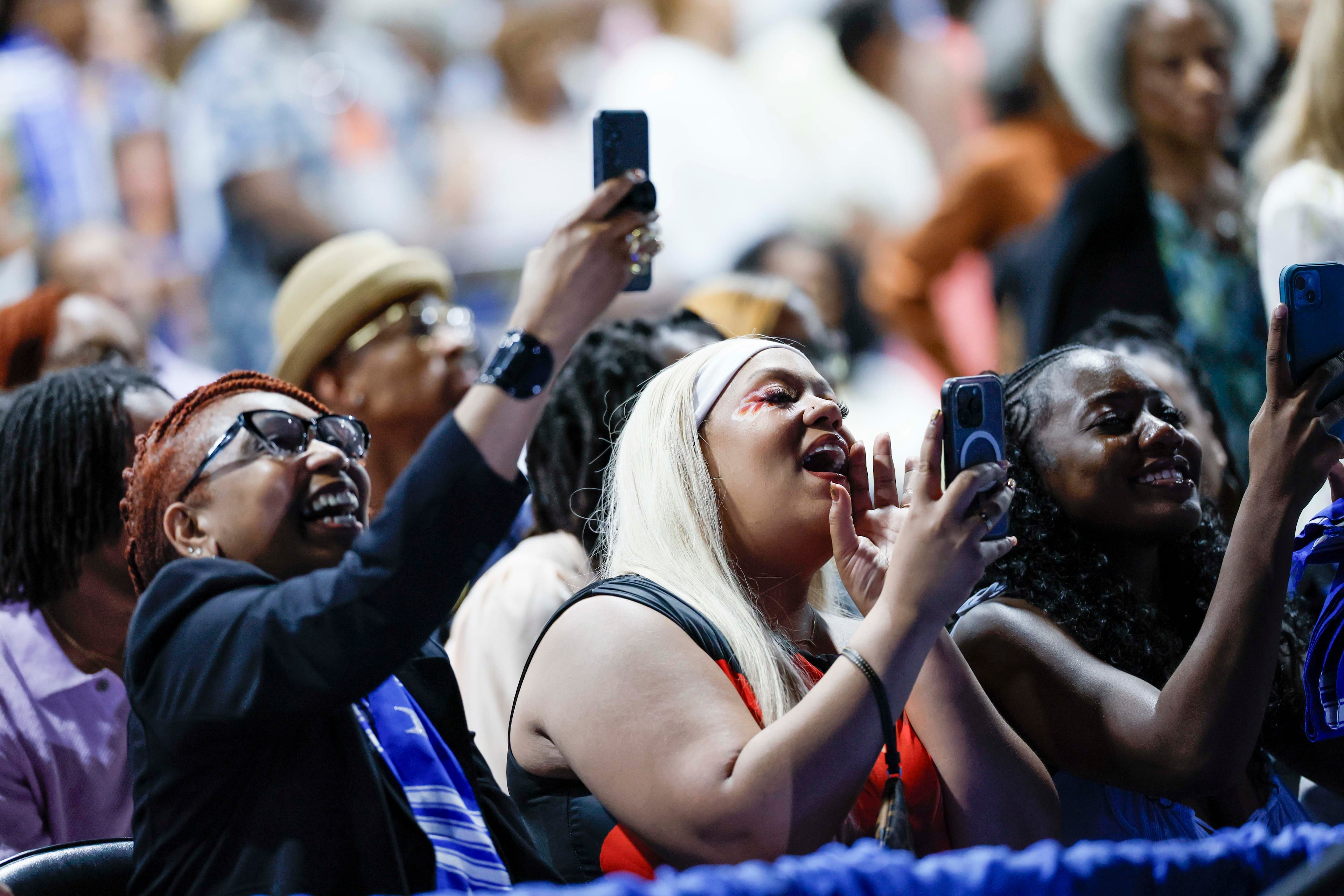 Friends and family cheer for their graduates during the Spelman College Commencement ceremony at the Georgia International Convention Center in College Park on Sunday, May 17, 2026. (Miguel Martinez/AJC)