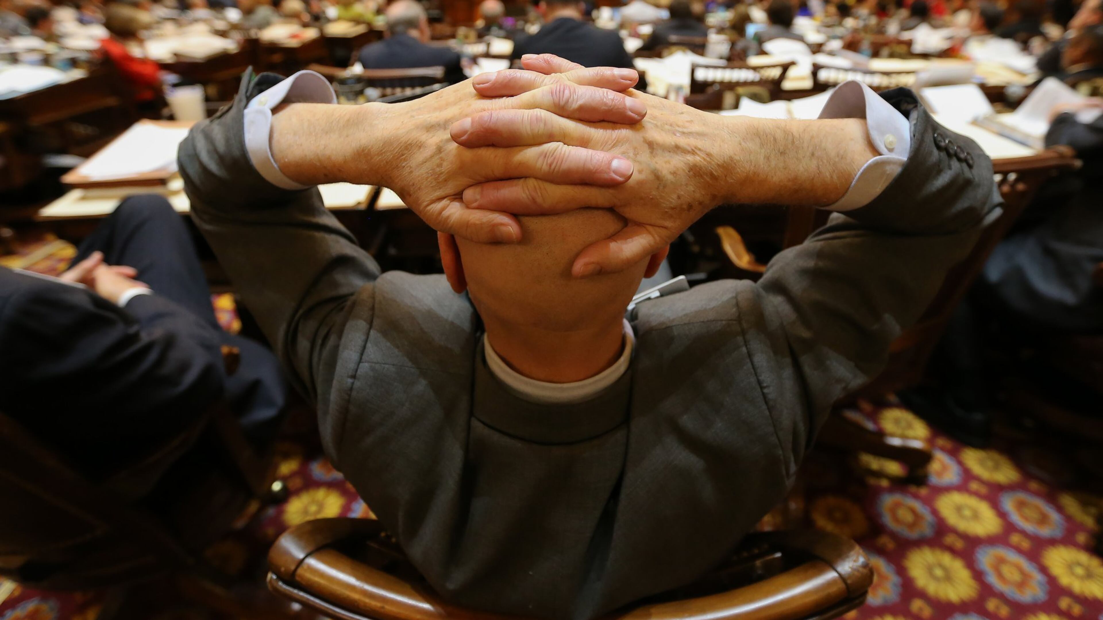 Rep. John Deffenbaugh, R- Lookout Mountain, leans back and listens as Rep. Stephen Allison, R-Blairsville, gives a farewell speech on Thursday, March 24, 2016 — the final day of the 2016 legislative session. BEN GRAY / bgray@ajc.com