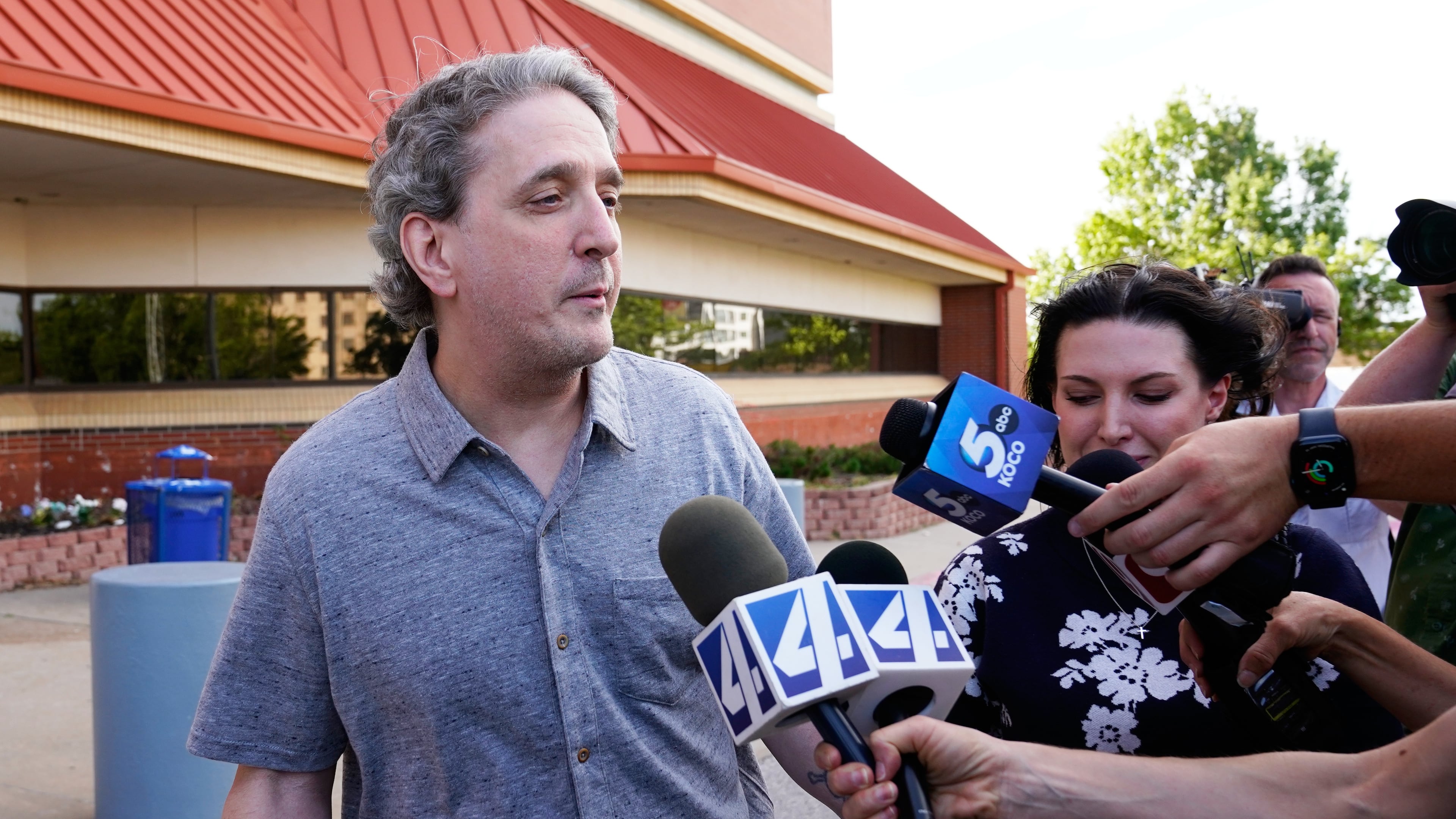 FILE - Former death row prisoner Richard Glossip, left, speaks to media after exiting a detention facility after being granted bond while awaiting retrial, May 14, 2026, in Oklahoma City. (AP Photo/Nick Oxford, File)