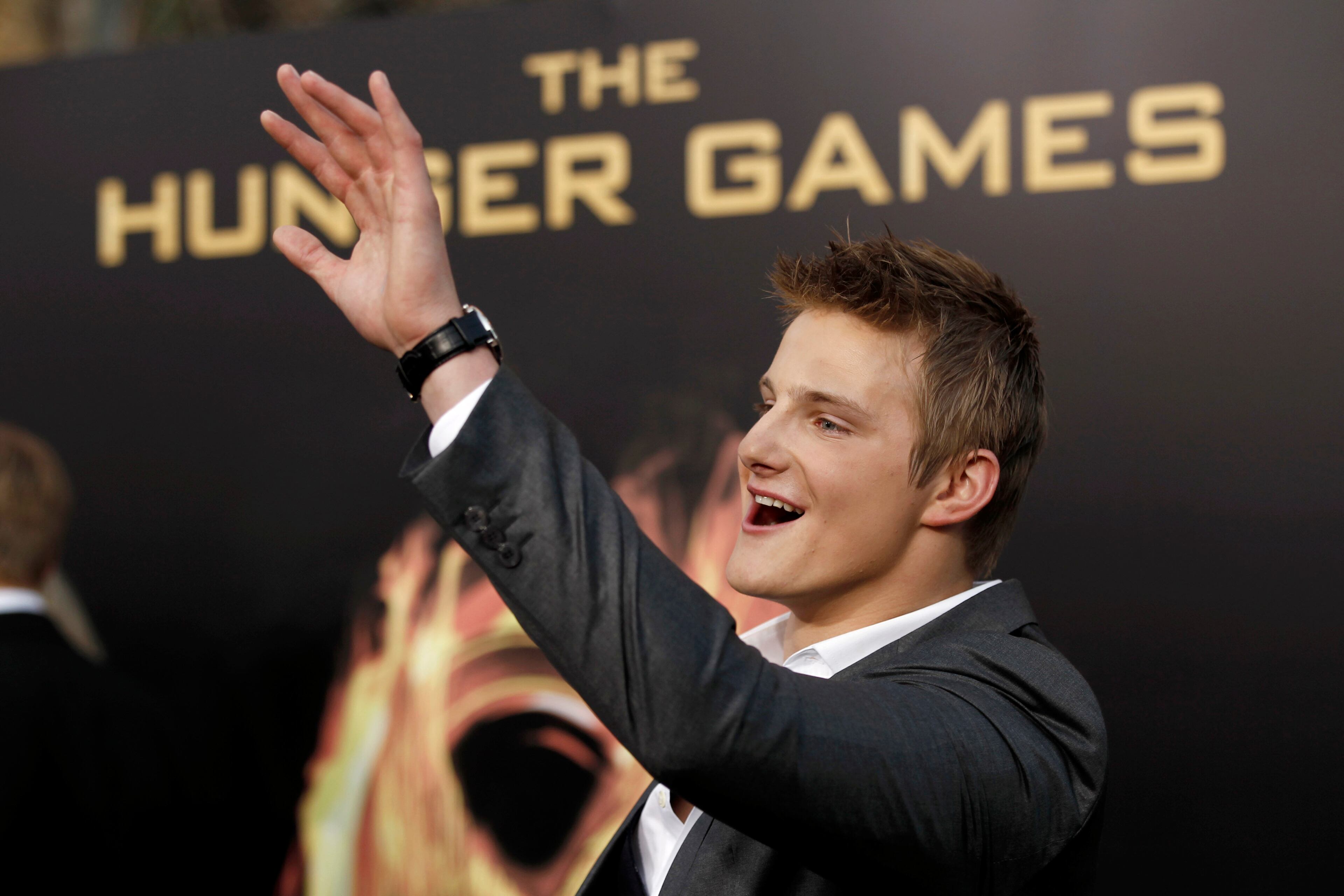 Alexander Ludwig arrives at the world premiere of "The Hunger Games" on Monday March 12, 2012 in Los Angeles. (AP Photo/Matt Sayles)